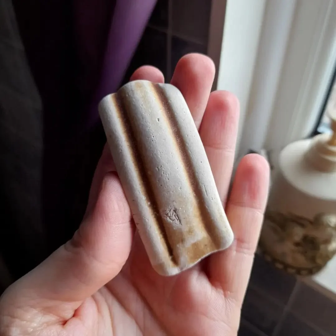 Part of a handle, age unknown.