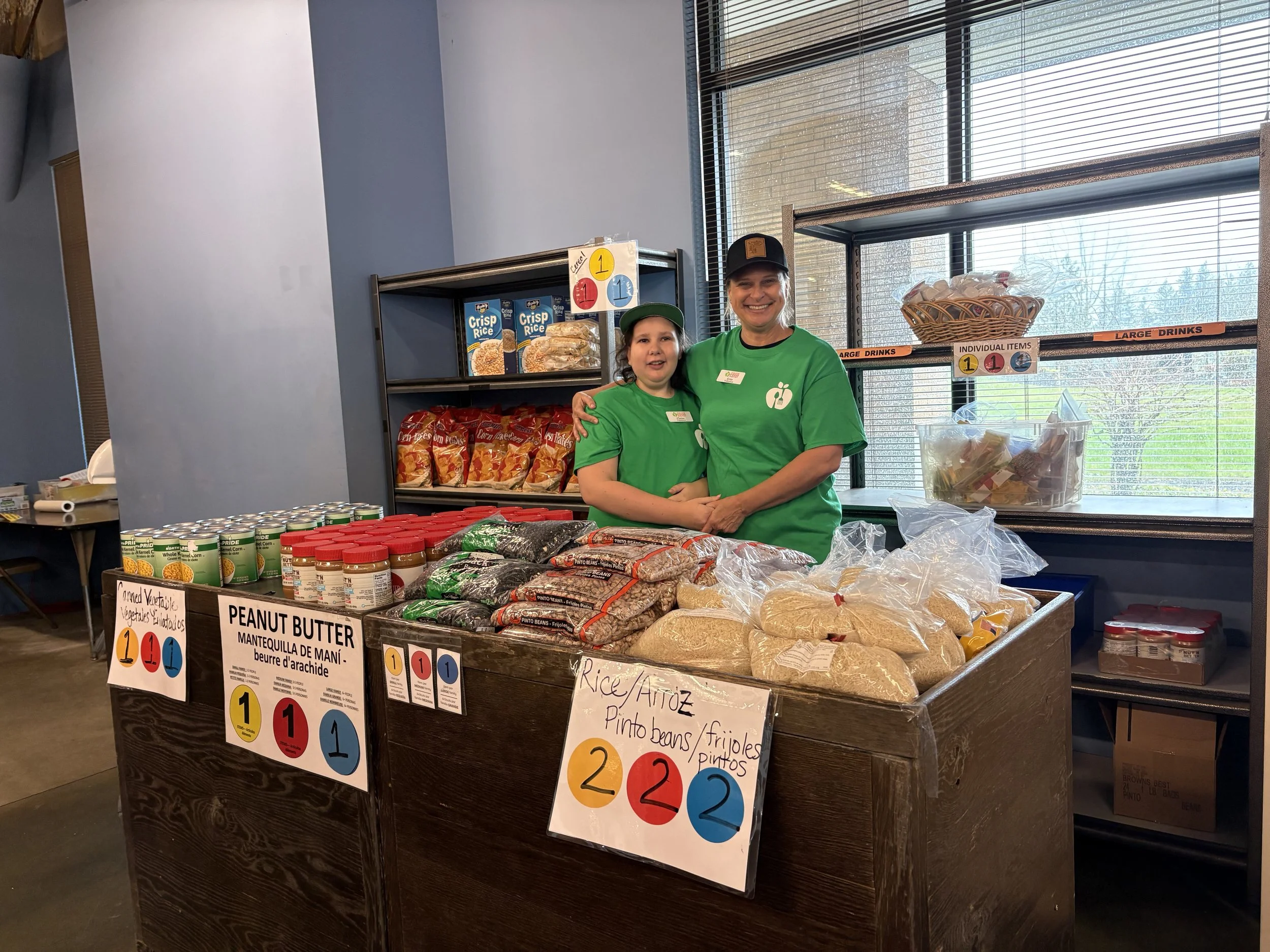 Claire and Erin pose together while volunteering at TFP