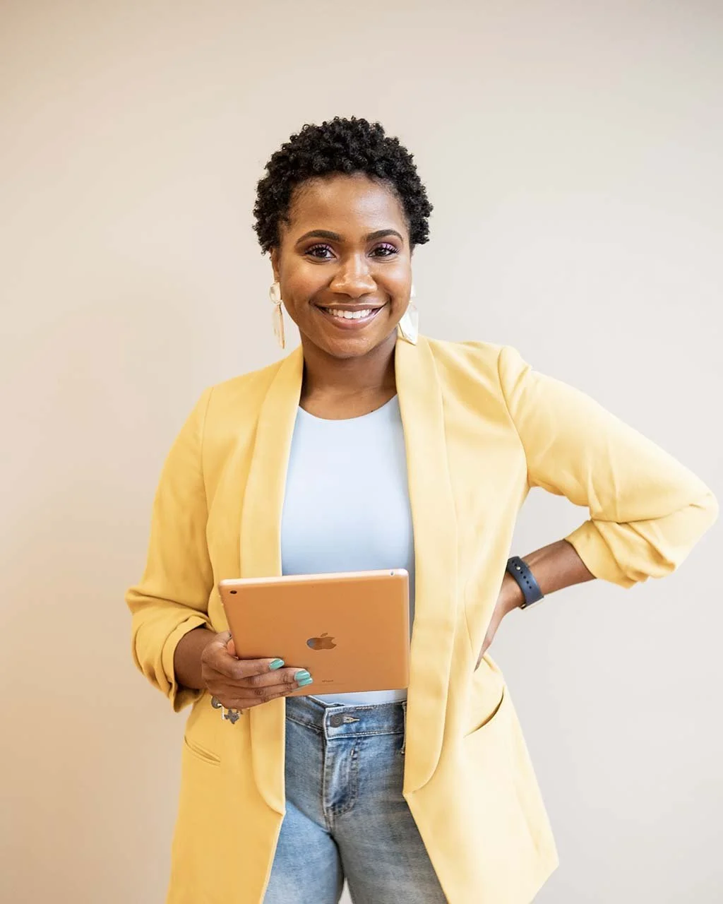 Nonprofit leader holding a tablet.