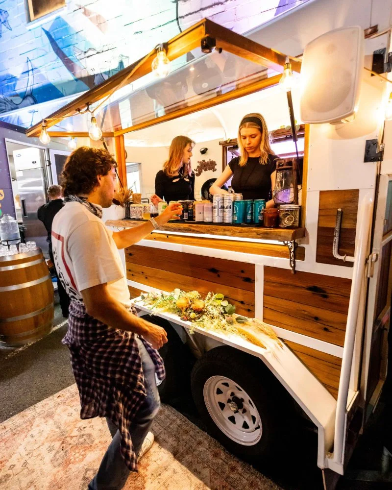 The Drunken Brumby horse float bar serving guests at an event
