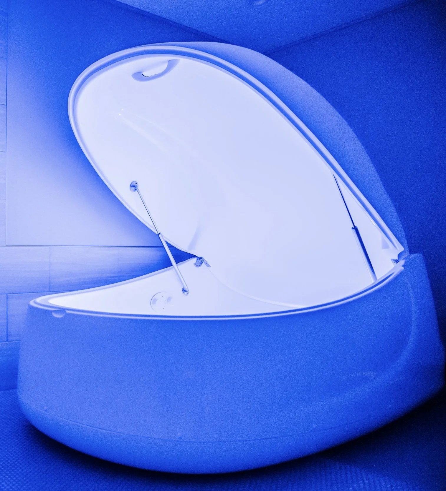Open float pod and guest floating with the lid open at The Salt Center in Alpharetta, GA