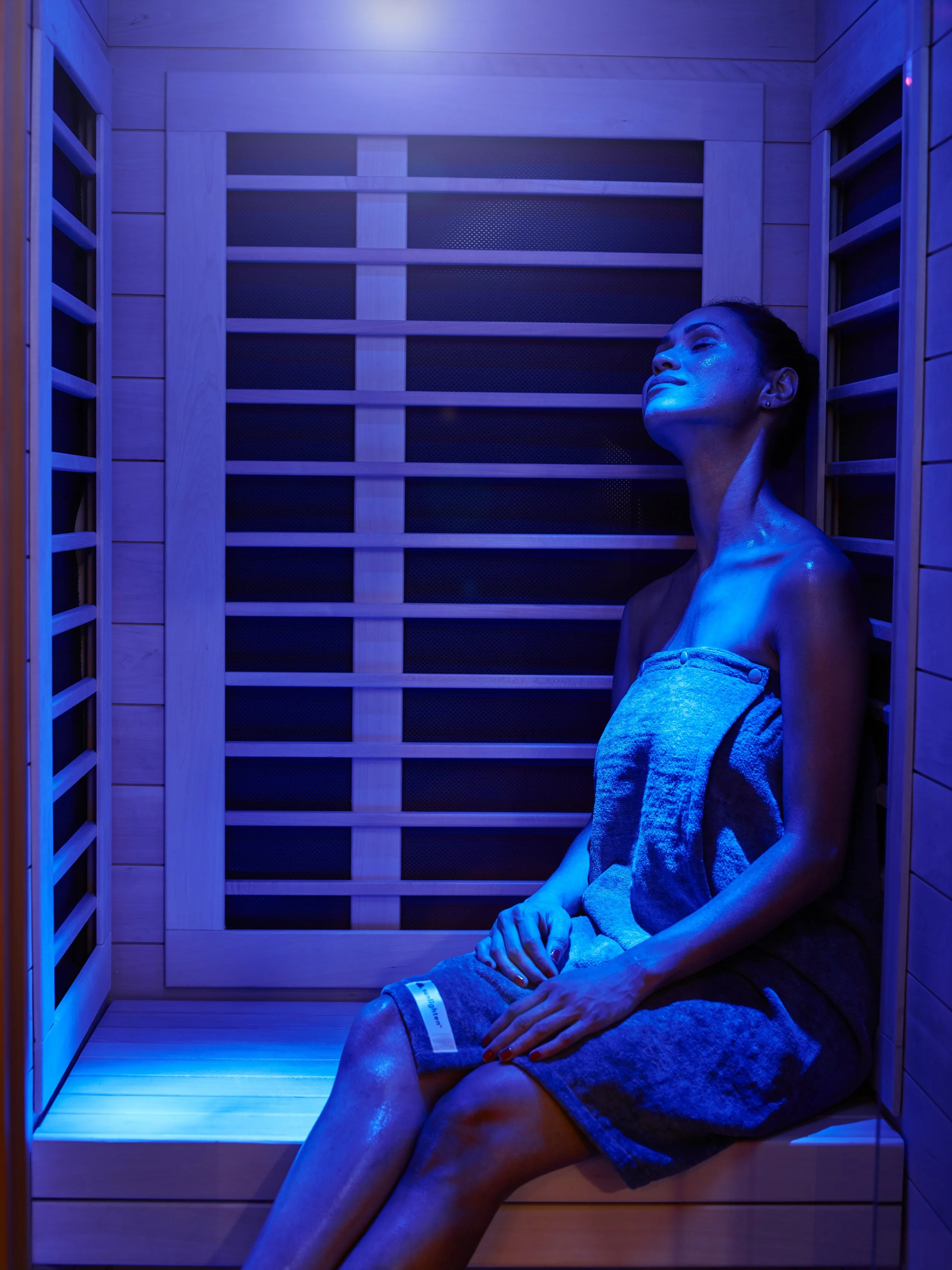 Employee using the Infrared Sauna as part of a corporate wellness program at The Salt Center in Alpharetta, GA