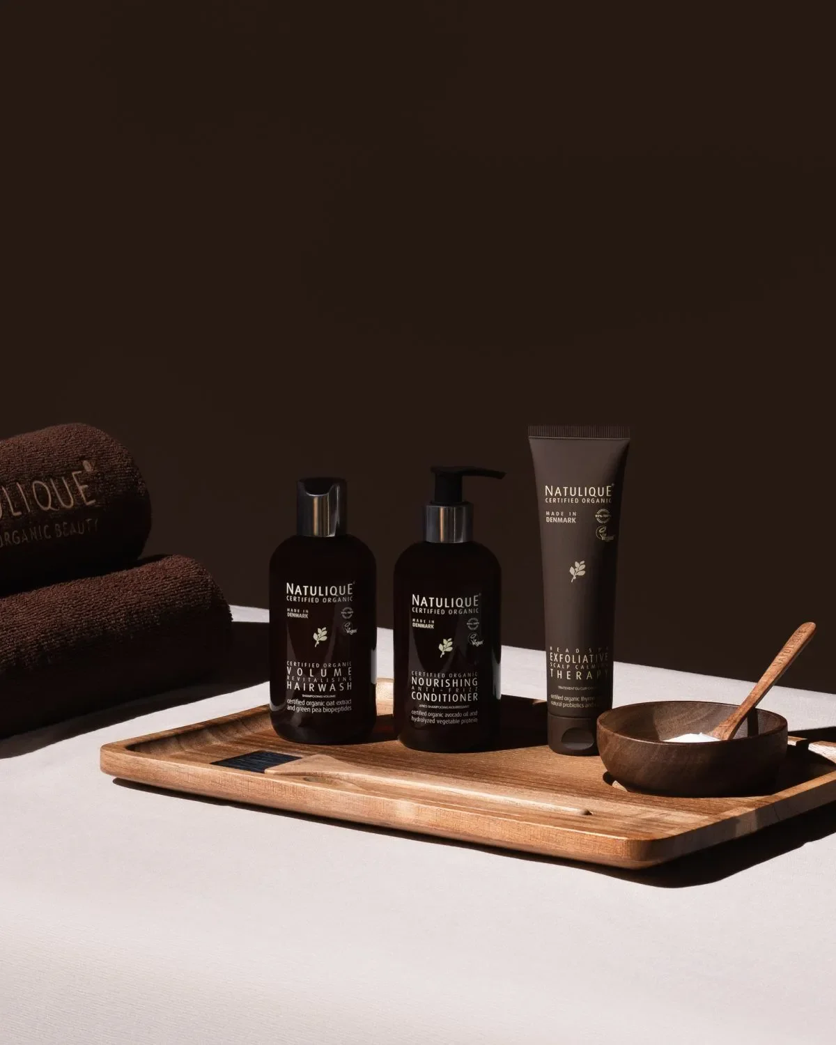 Organic Natulique hair care products used during head spa treatments at The Salt Center in Alpharetta, GA
