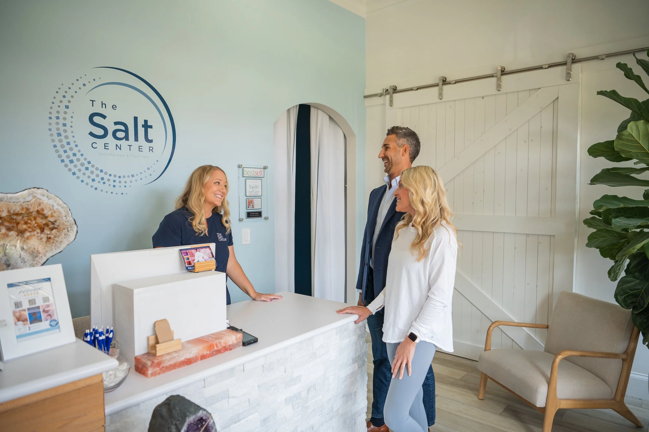 The Salt Center staff greeting guests at the front desk in Alpharetta, GA