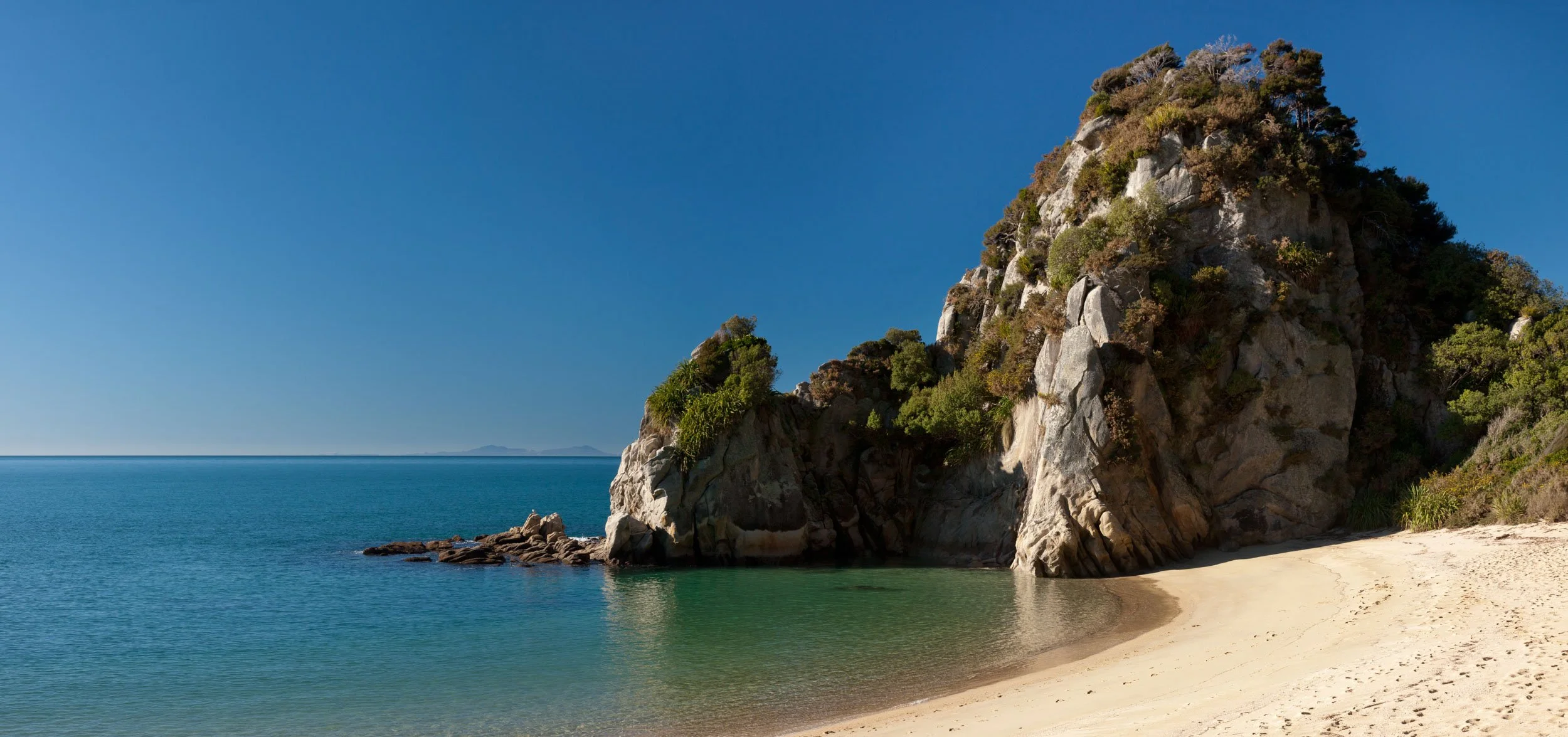 Rock formations at Anapai Bay.