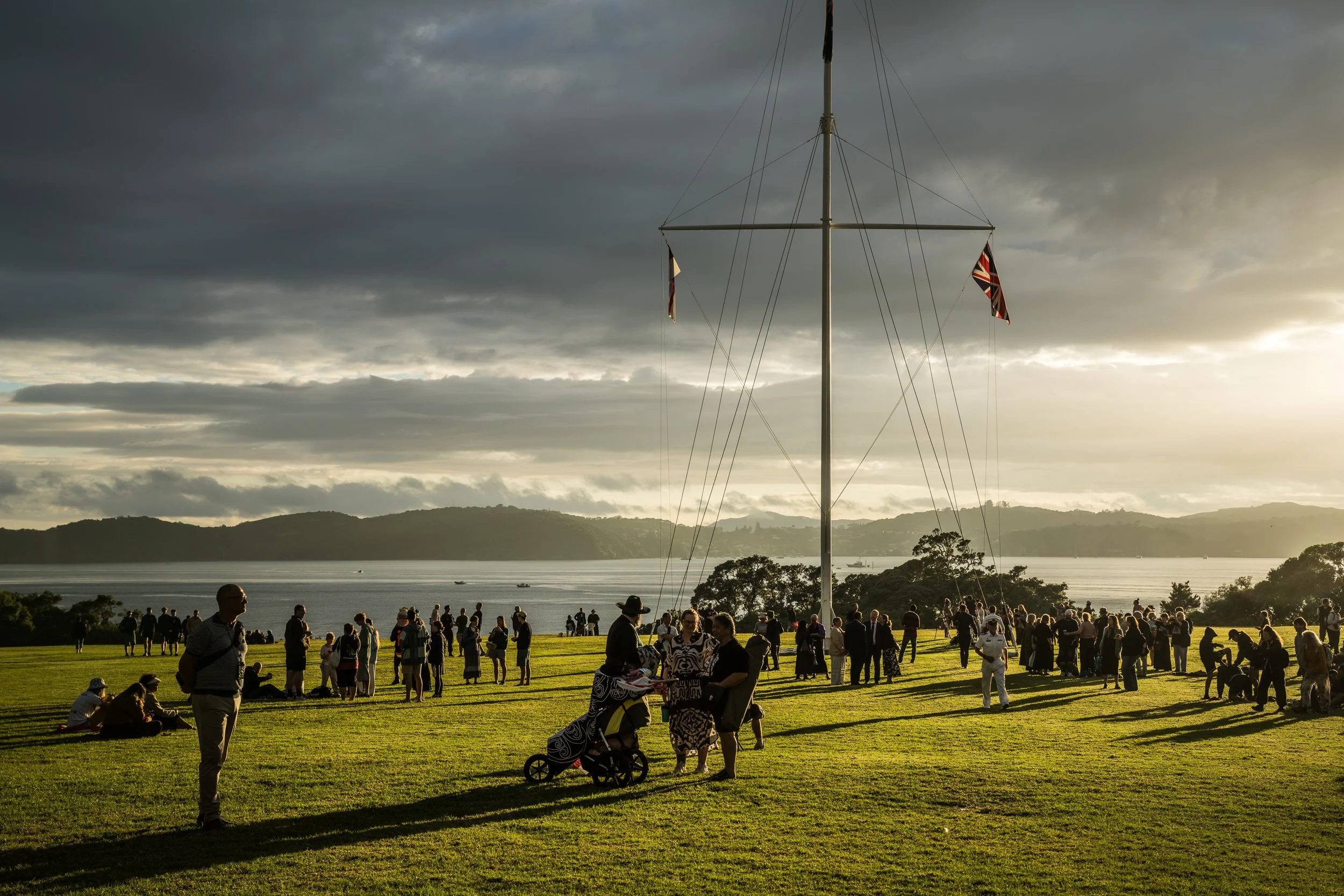 The three flags that fly over Waitangi Day celebrations are: 1. Te Kara — United Tribes flag; 2. Union Jack, 3. New Zealand flag.