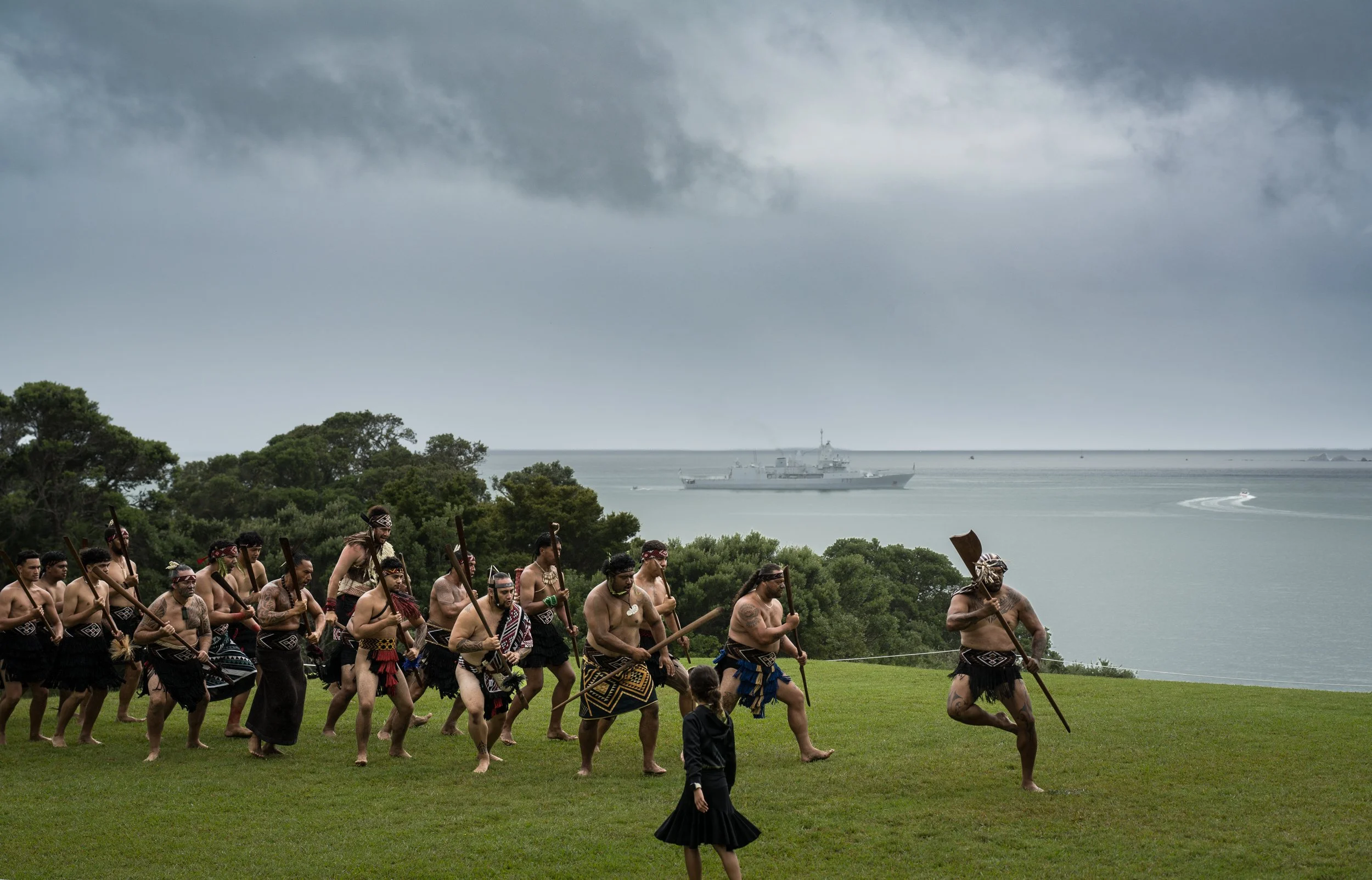 Practicing for a challenge, with the Royal New Zealand Navy ship HMNZS Te Kaha in the background.