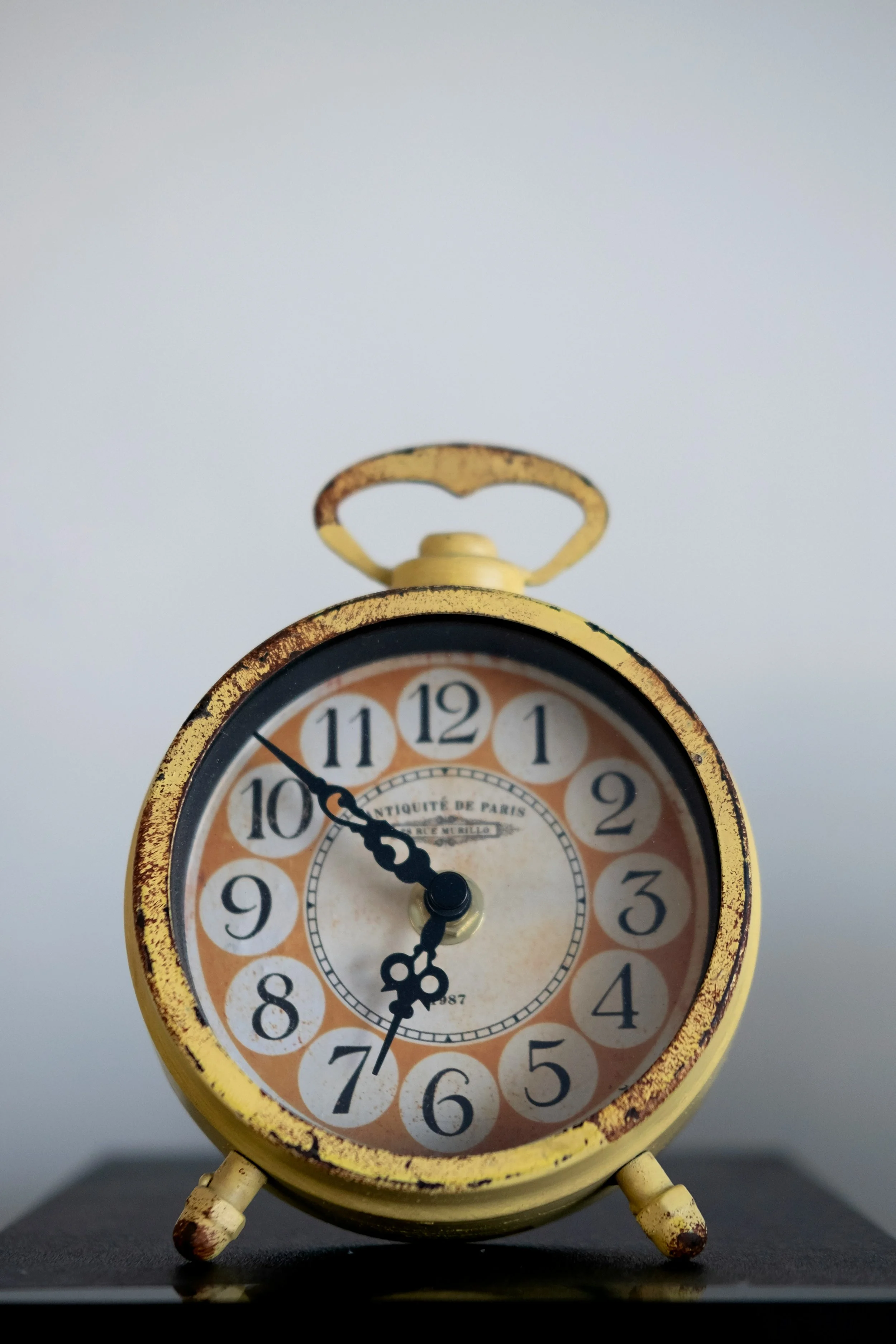 old yellow alarm clock
