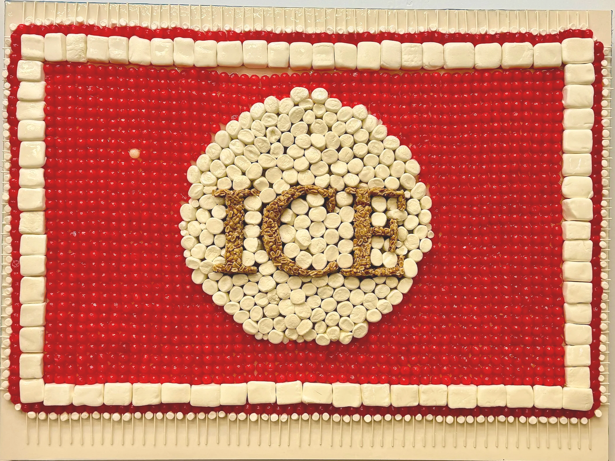 Immigration: The New Racism. Dum Dums Line Up for the PayDay.  36"H x 48"W Medium: DumDum Lollipops, Marshmellows, PayDay Candy on Clayboard