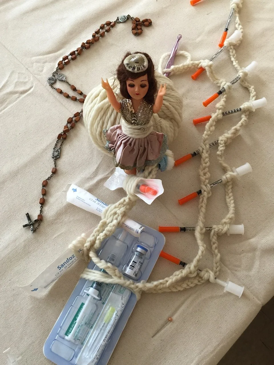 The Infertility Rosary (Detail)
7' x 6'
Printed Hysterectomy Report on Paper, Drawing on Journal Paper, Vacutainers, Antique Doll, Silk Ribbon, IVF Syringes, Virgin Wool, Torn Vellum