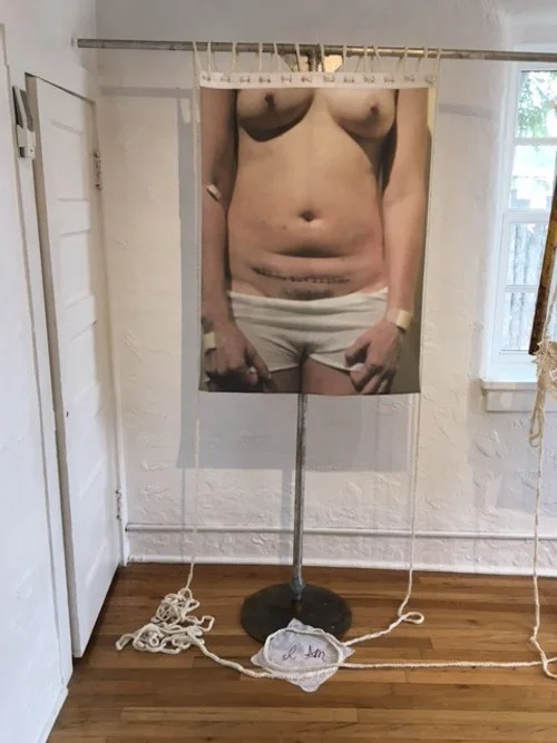 Each piece is edged with a single strand of crocheted virgin wool, formed one stitch at a time. This slow, repetitive process parallels the lived reality of profound grief, where survival occurs incrementally rather than through resolution. The unpro