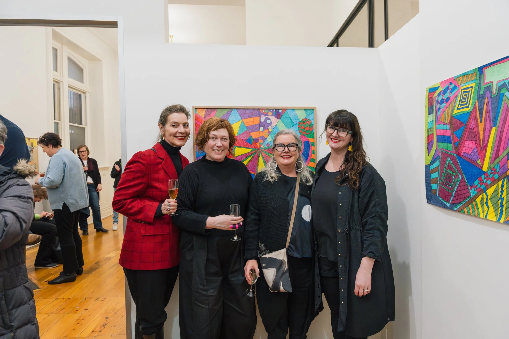 Opening of Convergence 2025 with people in a light filled gallery space.