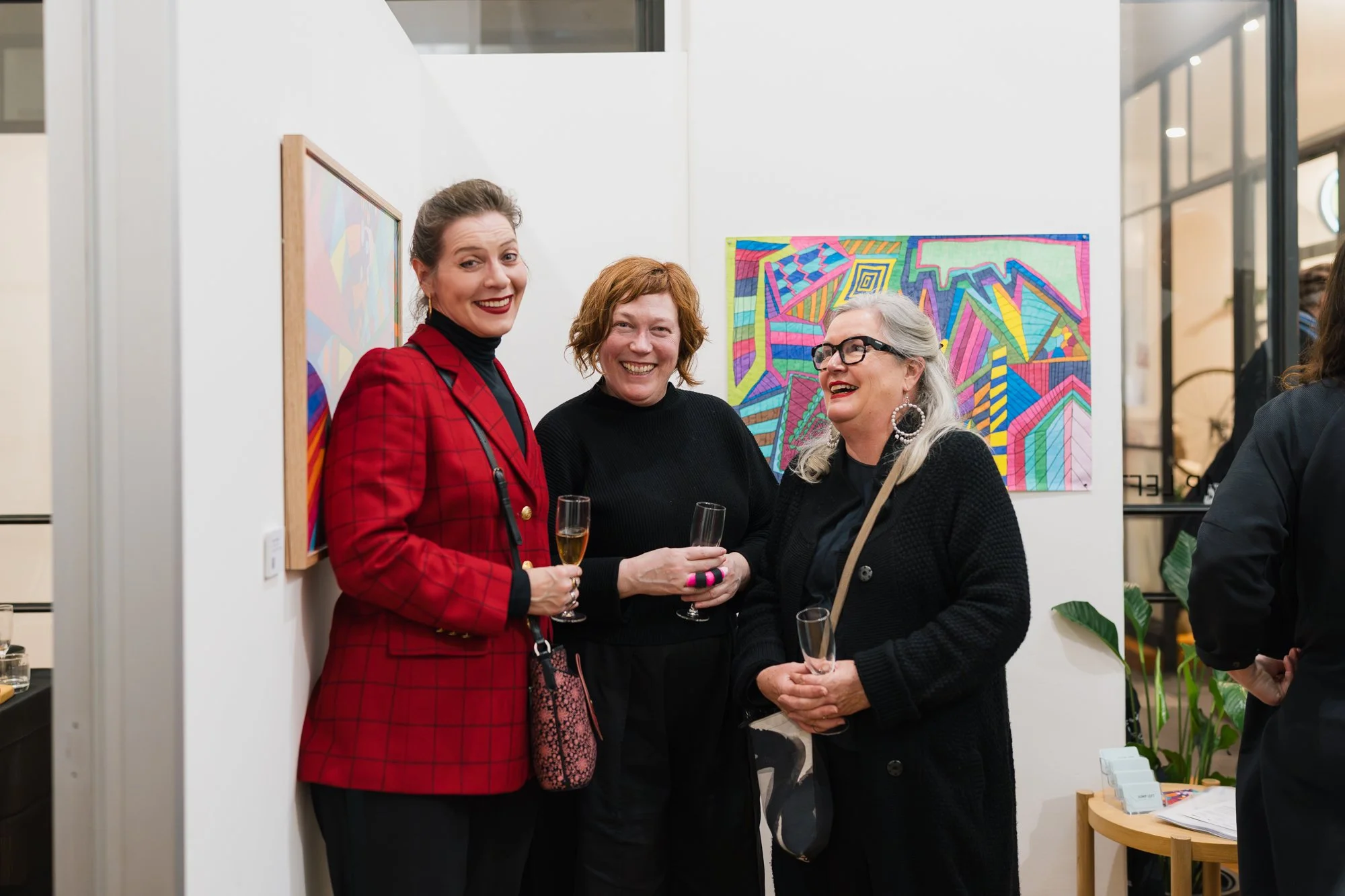 Opening of Convergence 2025 with people in a light filled gallery space.