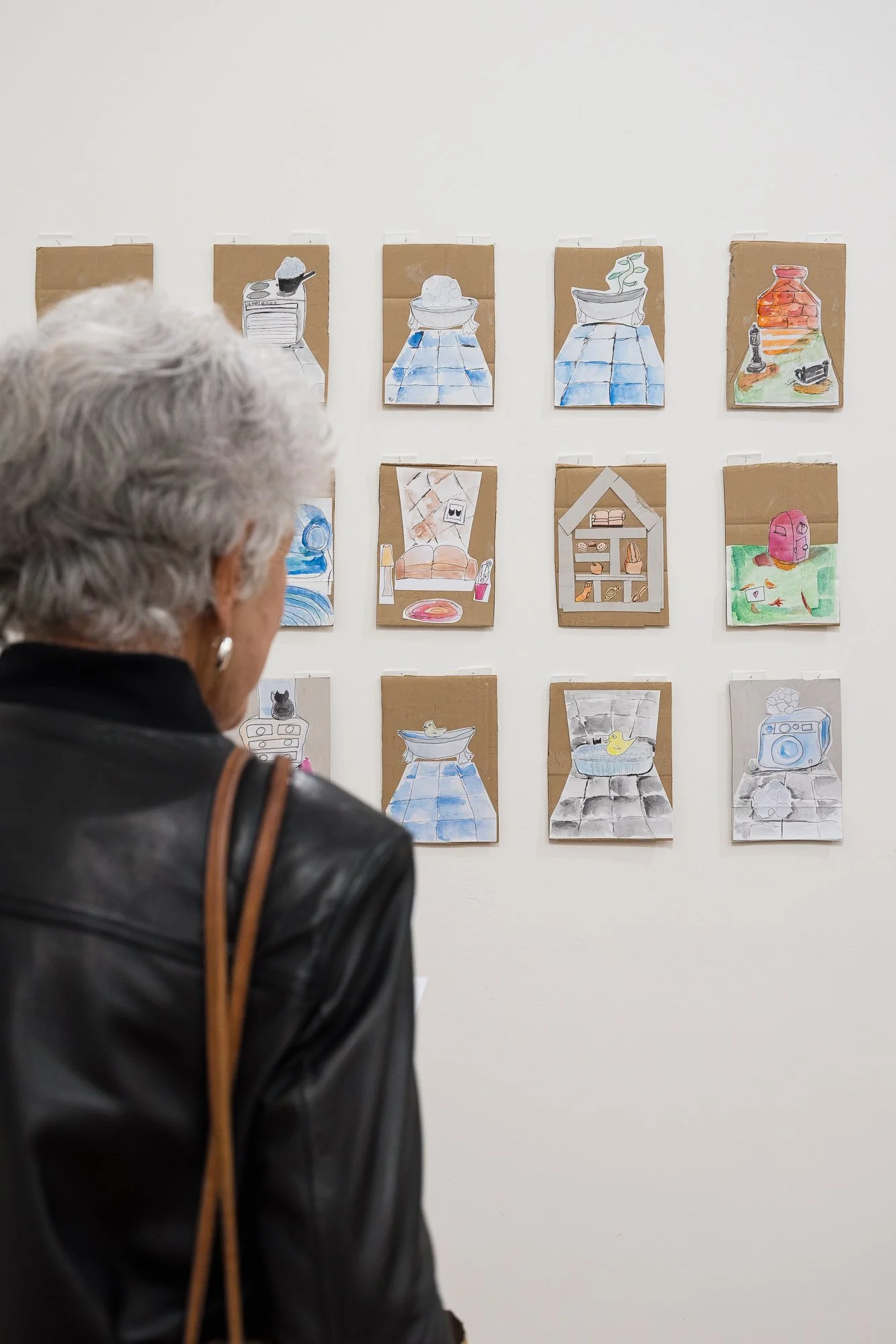 Guest observing artworks in an exhibition
