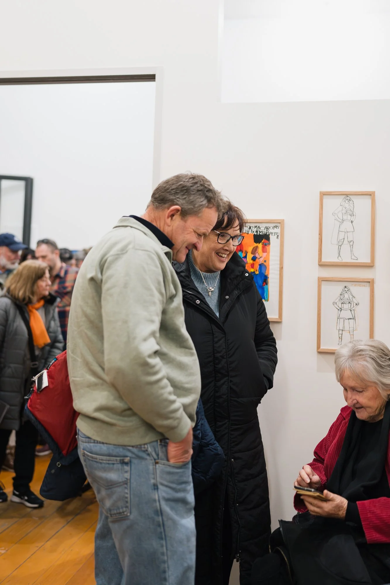 Opening of Convergence 2025 with people in a light filled gallery space.