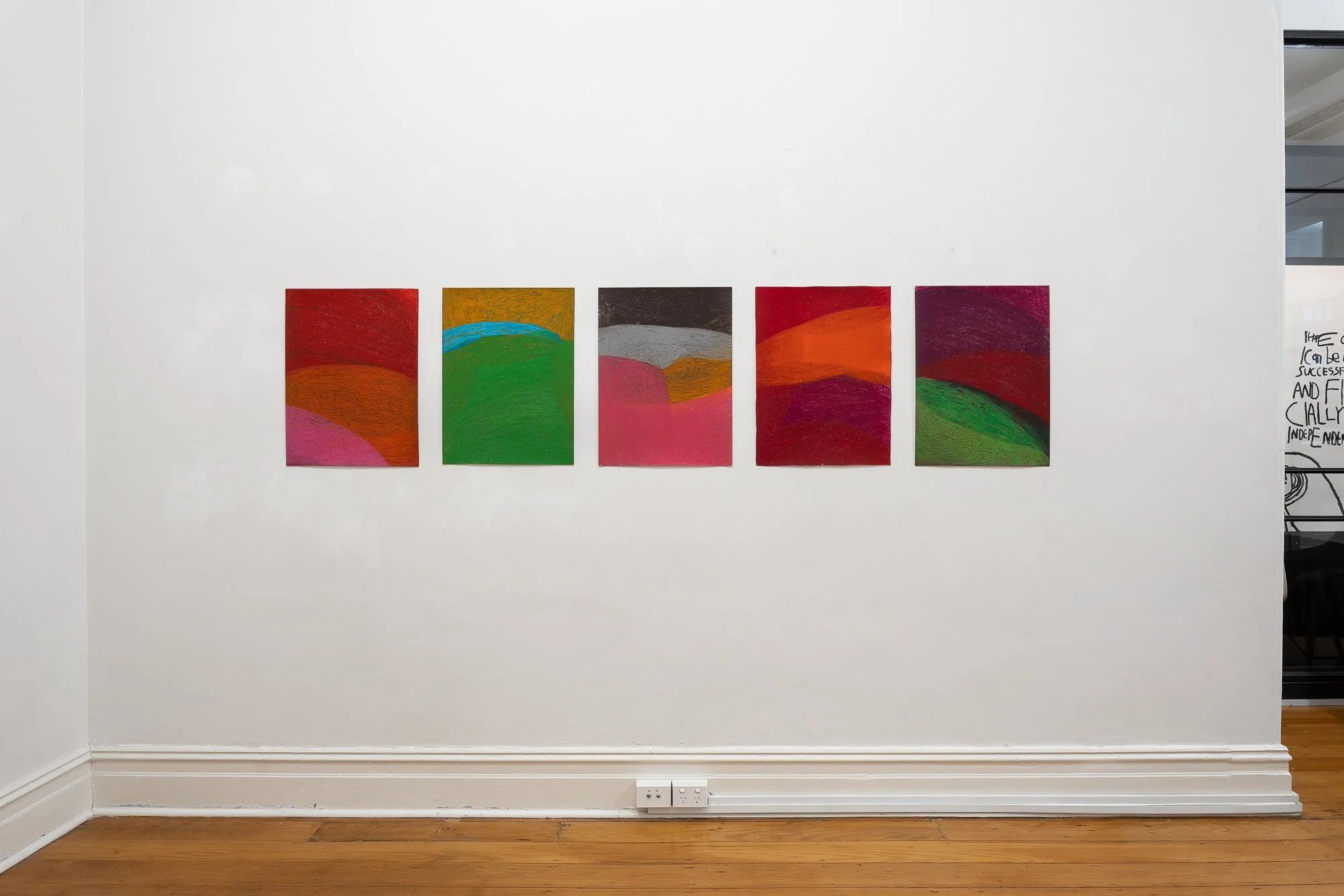 Installation image of five medium abstract artworks in a white gallery space with wooden floors