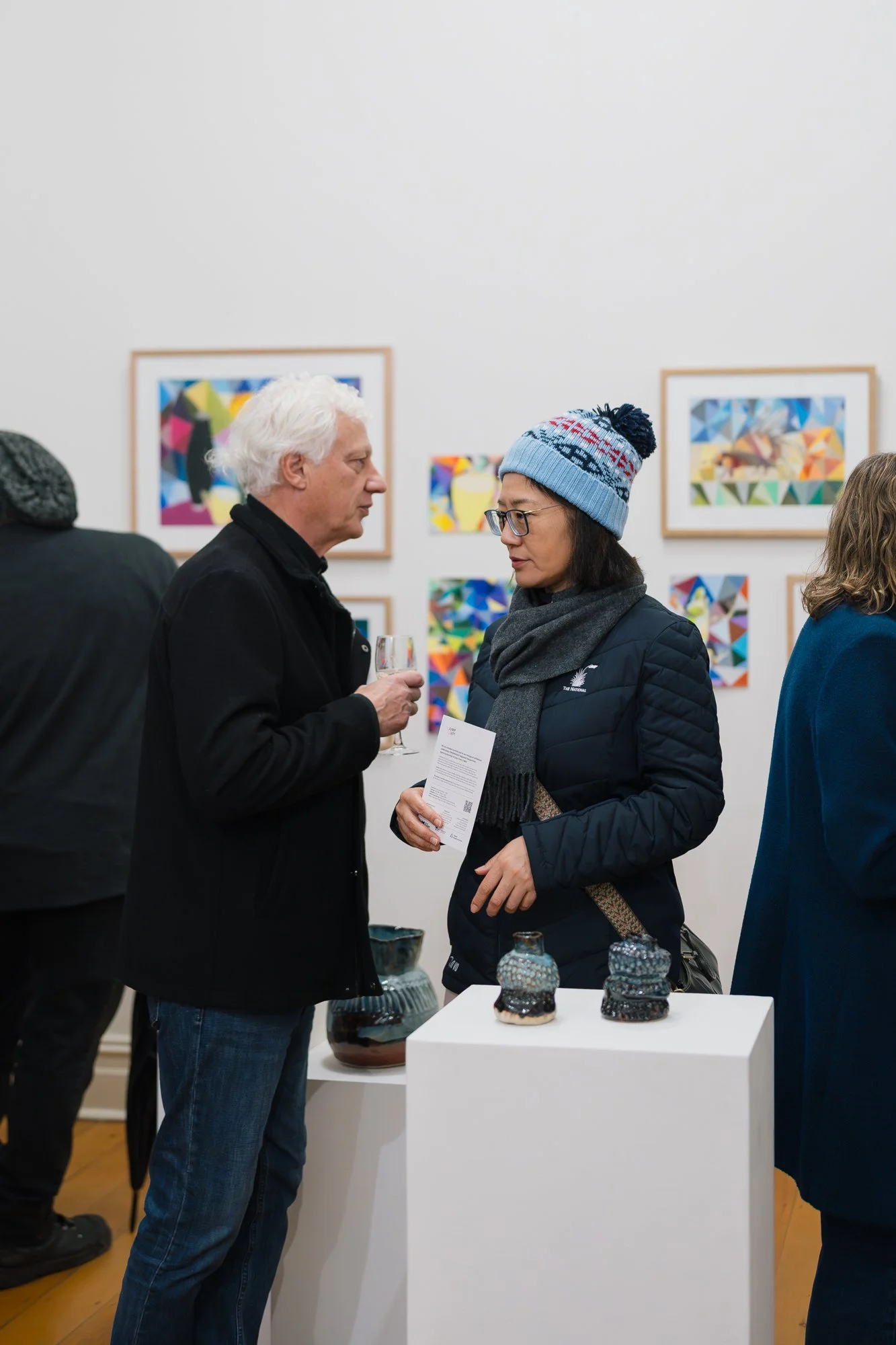 Opening of Convergence 2025 with people in a light filled gallery space.