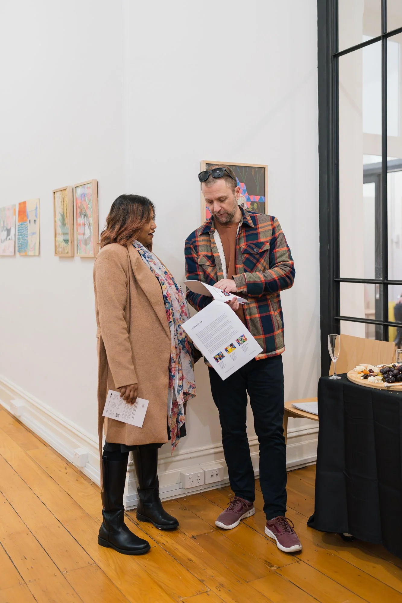 Opening of Convergence 2025 with people in a light filled gallery space.