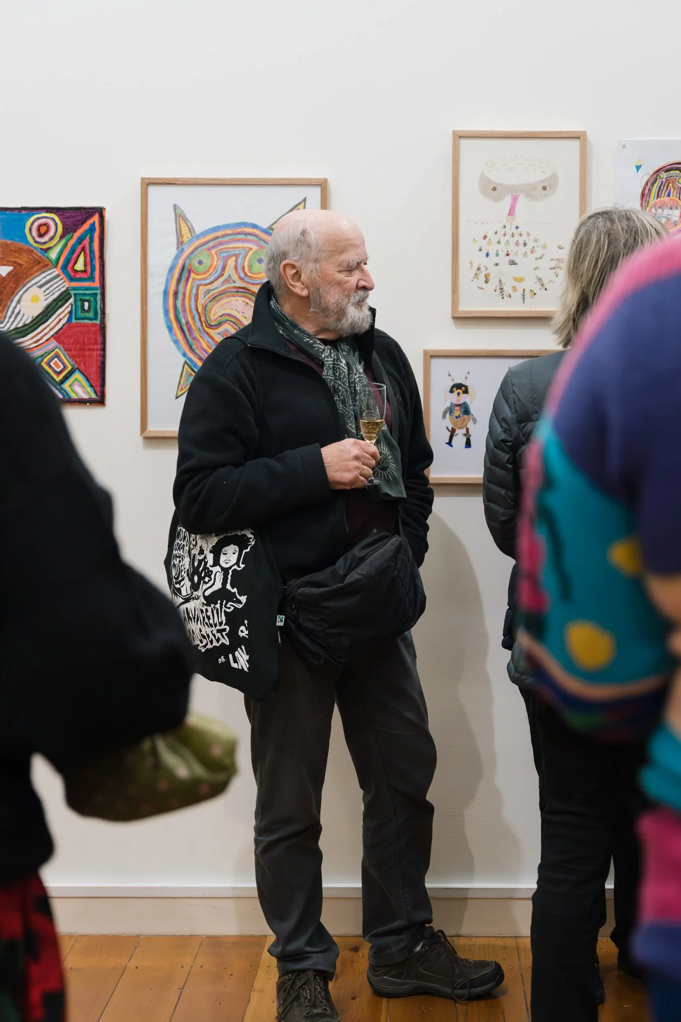 Opening of Convergence 2025 with people in a light filled gallery space.