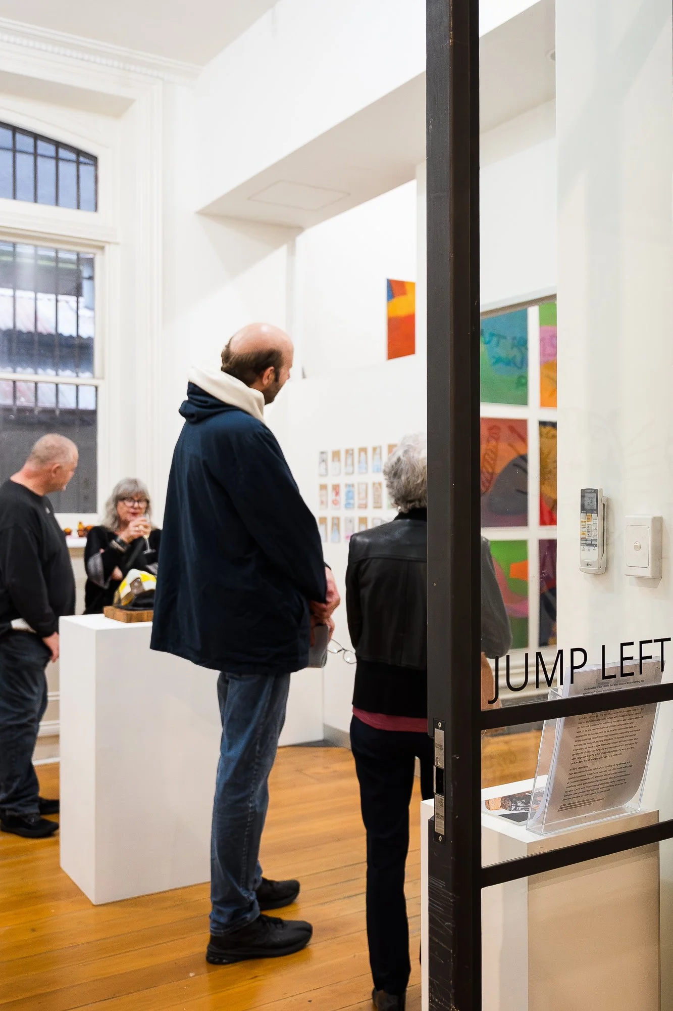 People happily yalking to each other at an exhibition