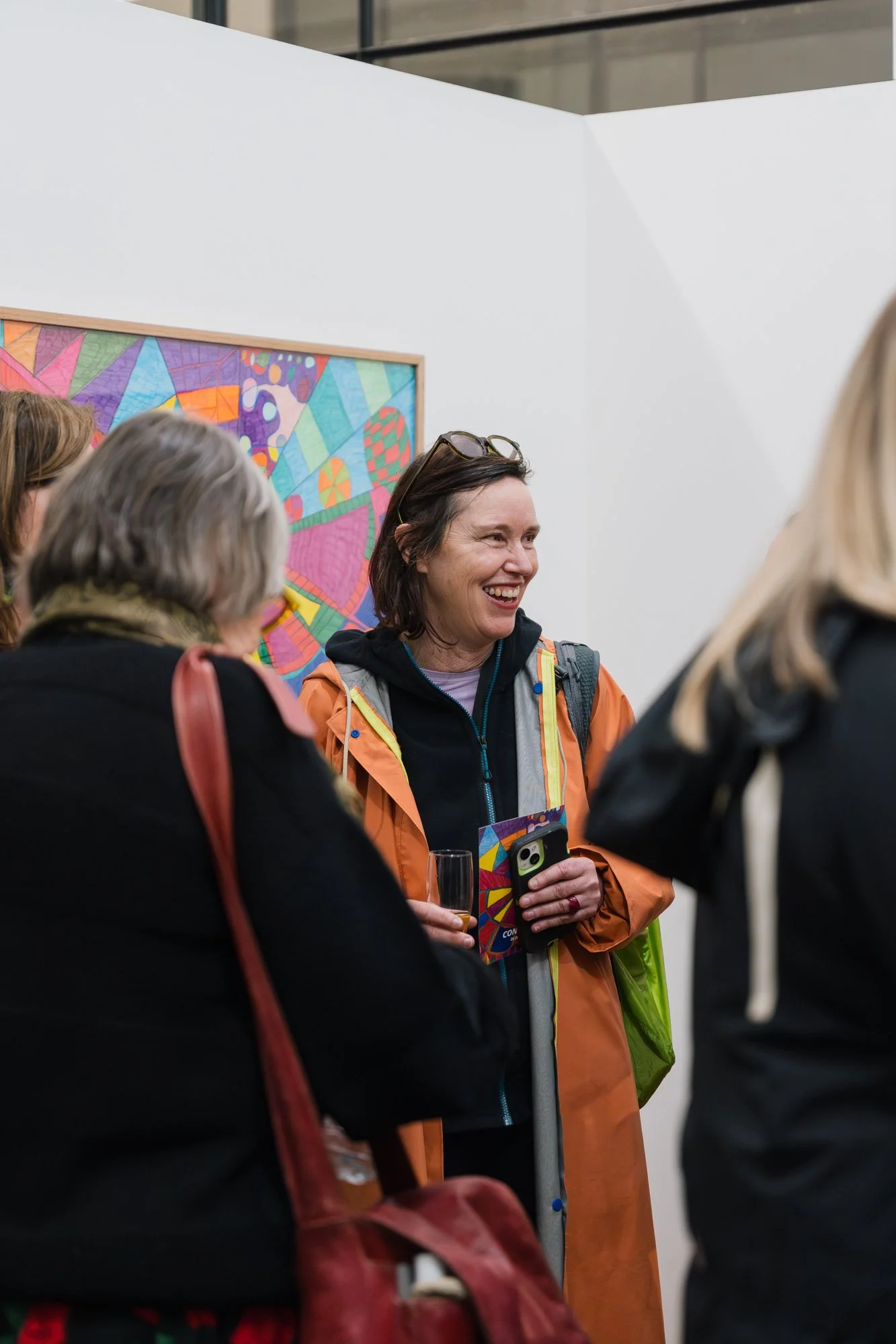 Opening of Convergence 2025 with people in a light filled gallery space.