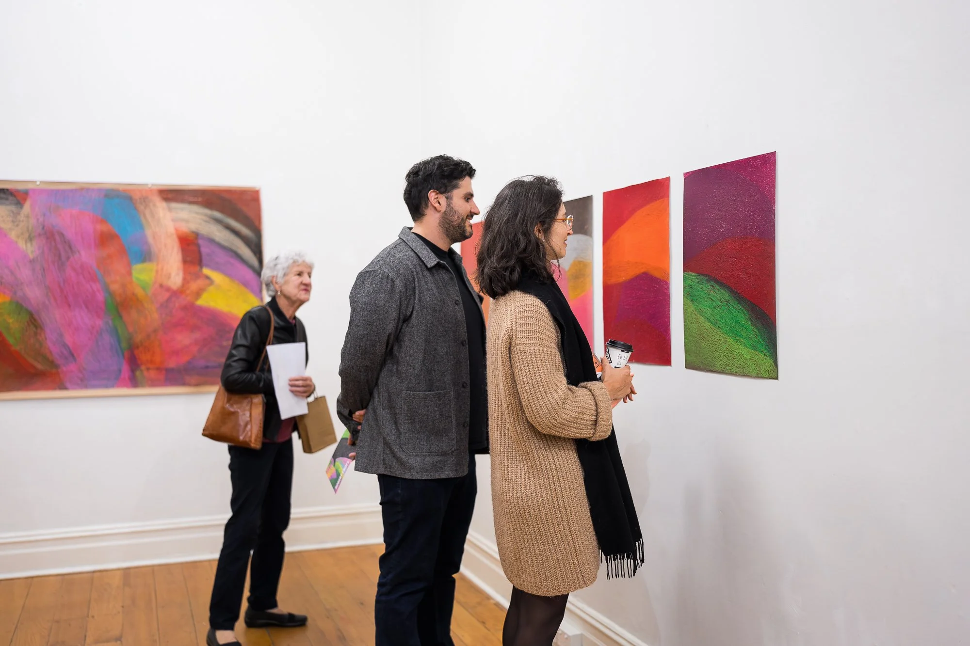People observing a abstract drawing installation in an exhibition