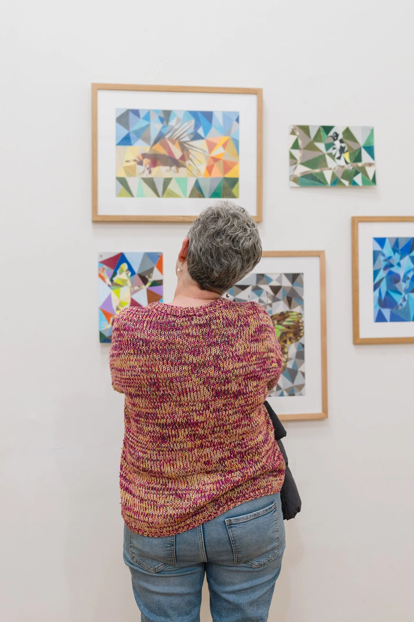 Opening of Convergence 2025 with a person in a light filled gallery space.