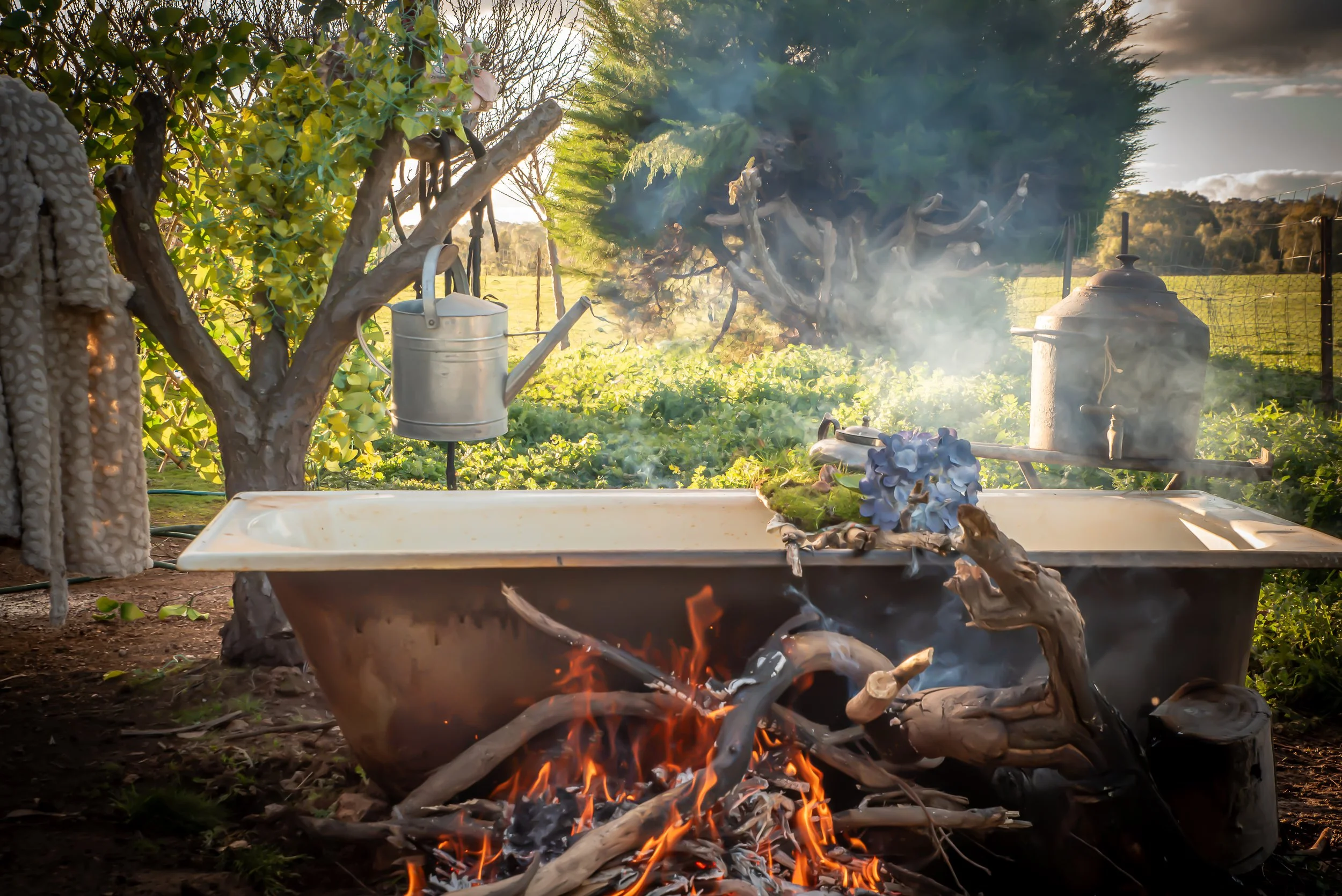 Wood-Fired Outdoor Bath with Copper Boiler on an Off-Grid Property