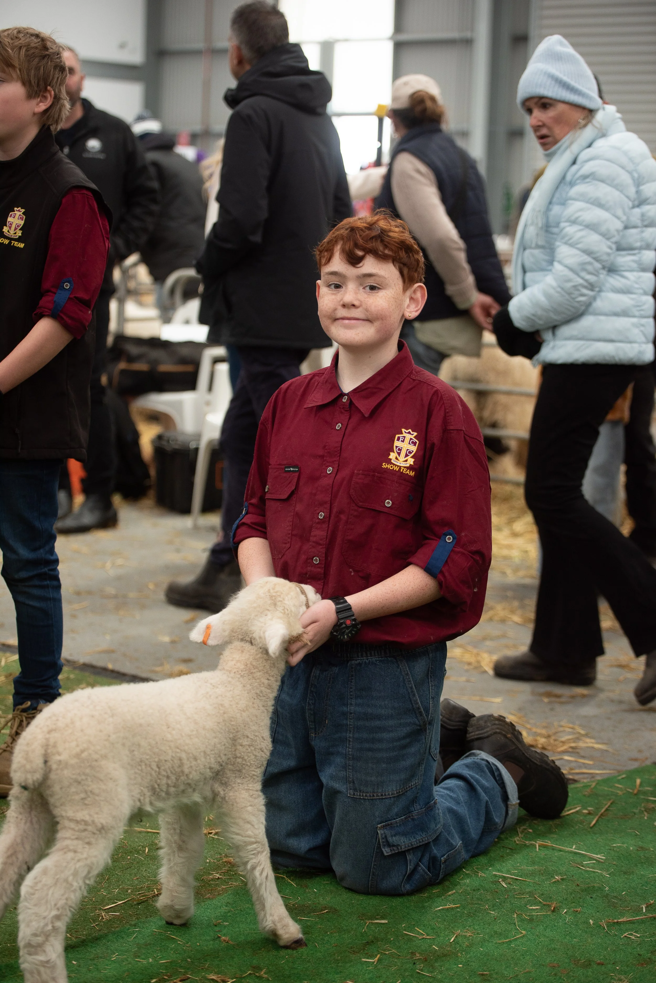 Young sheep exhibitor with lamb at the 2026 Victorian Sheep Show in Ballarat