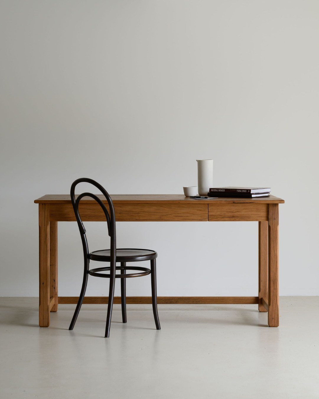 ELTON | Desk

Inspired by the deeply human act of creative writing, the Elton desk balances quiet strength with slim, elegant lines and traditional chamfered leg detailing. Crafted from recycled Blackbutt salvaged from a residence in Yanderra NSW, it