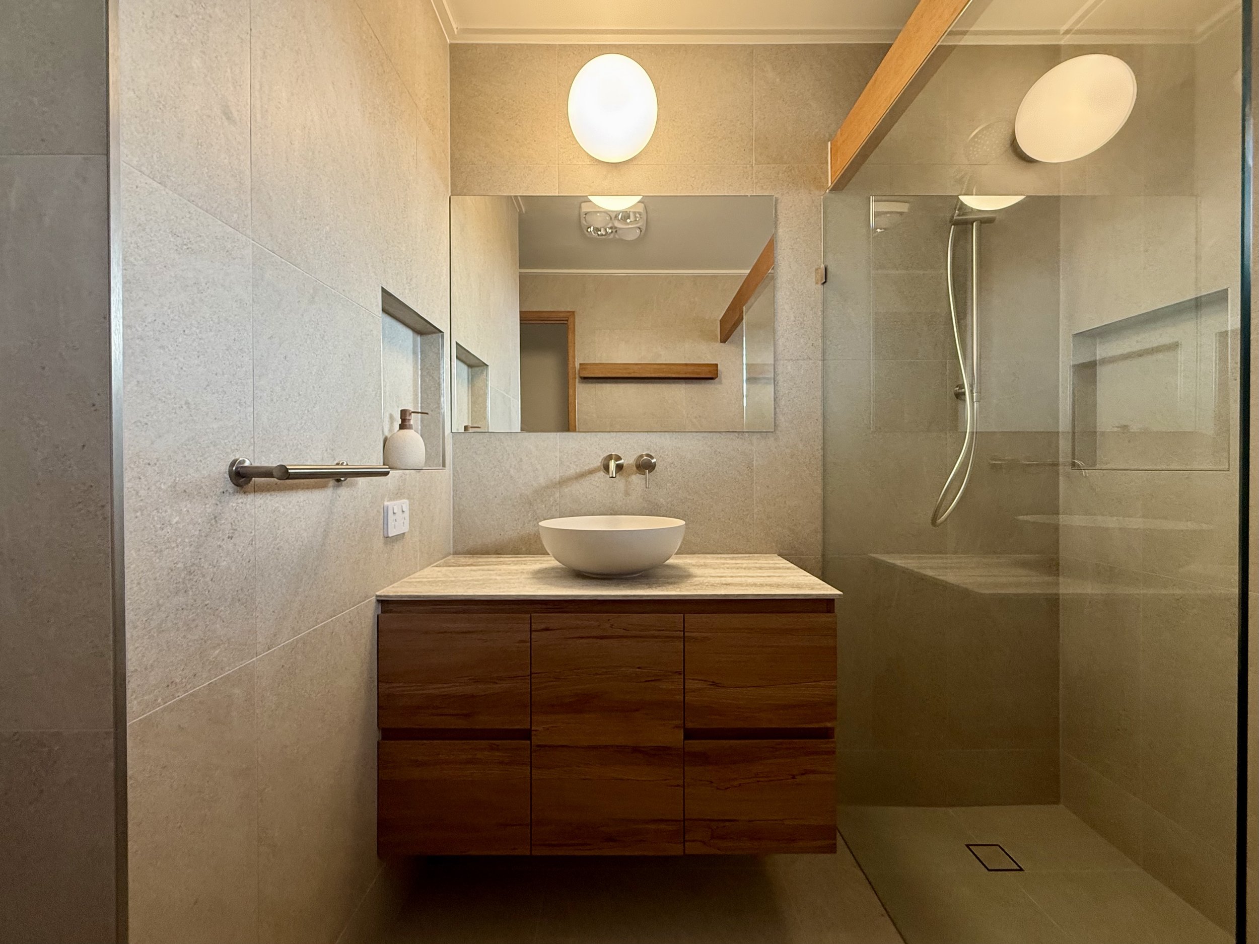 Australian Native custom vanity with above counter basin and brushed nickel tap ware
