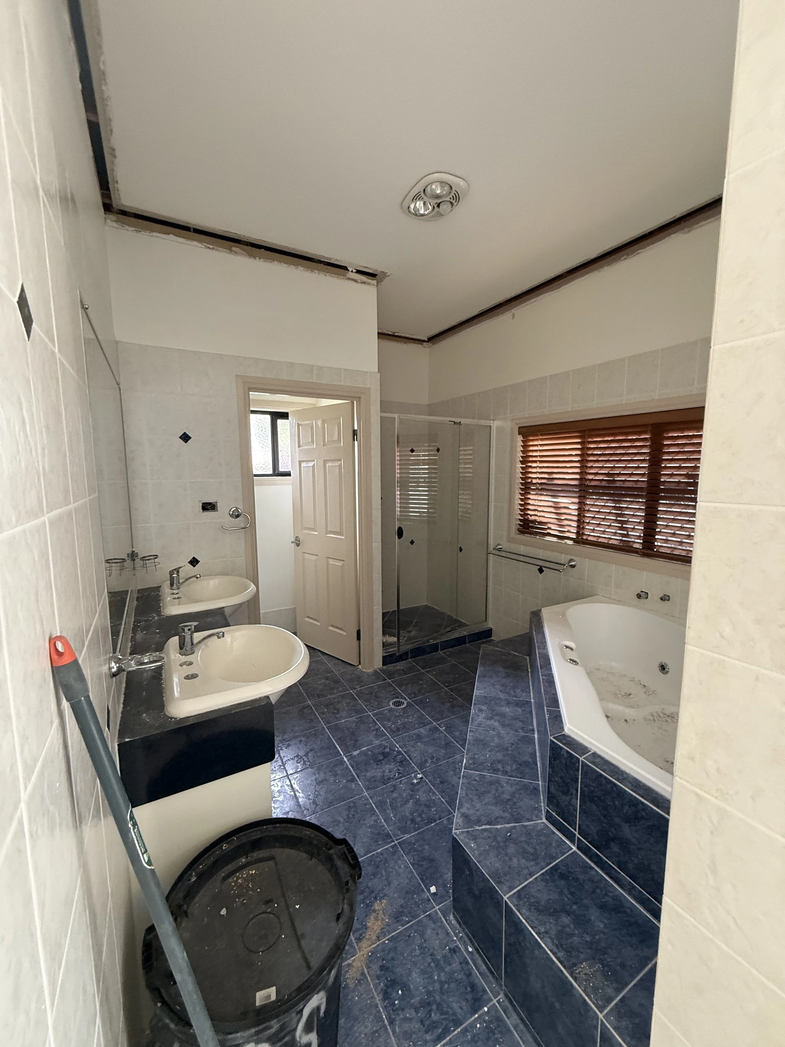 Bathroom renovation before construction, showing the original vanity and fittings in this Wellington Point bathroom.
