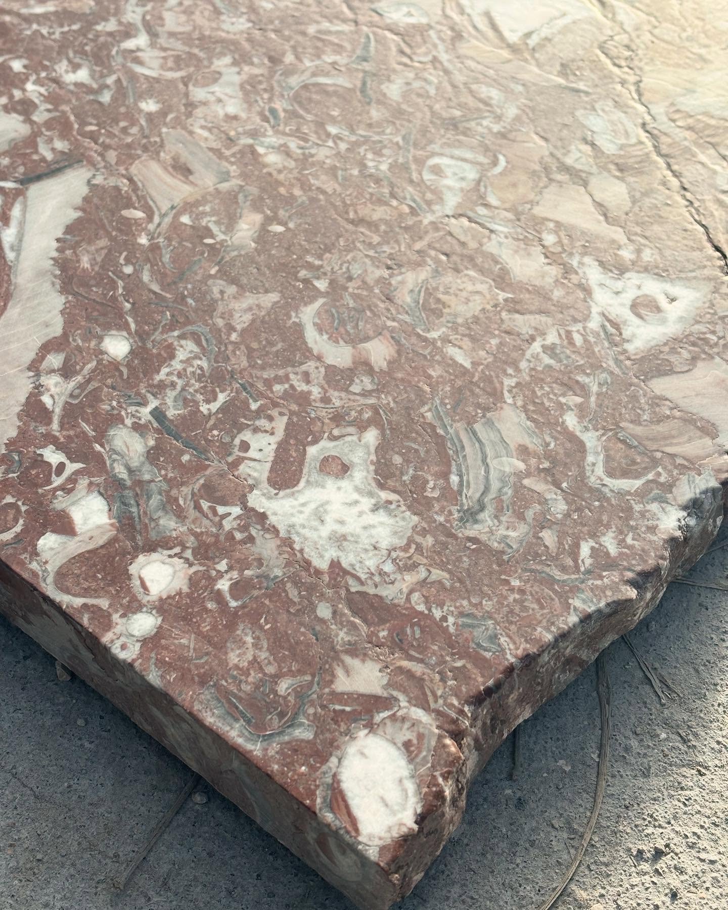 For our Bilbao table to achieve the 1.8 meter diameter we reused materials salvaged from neglected broken slabs.
Forgotten about for years, laying under the Spanish sun, a beautiful aged patina had naturally occurred&hellip;
This earthy red with whit