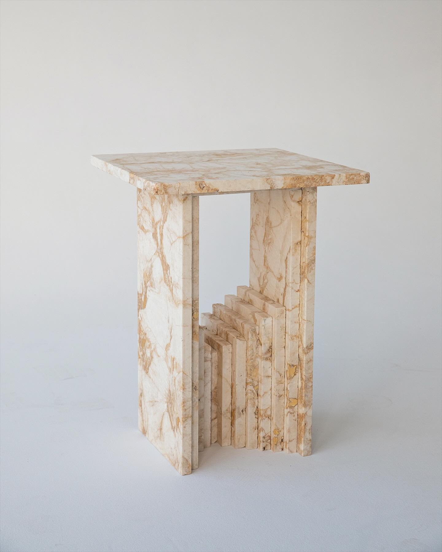 Tepui side table design, inspired by the undulating table top mountains of Venezuela, available in myriad of materials.

Making use of all sizes of offcuts to create a solid tiered central base with a canopy top, displaying the beauty of natural ston