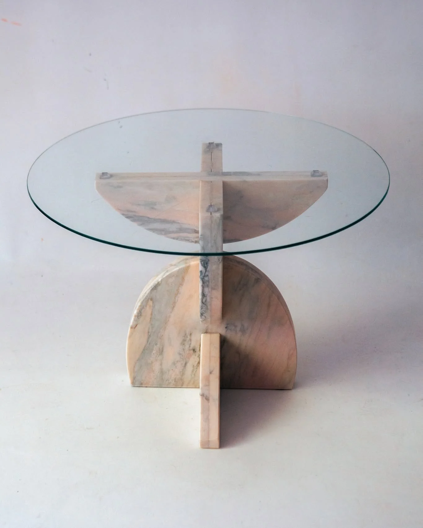 This frontal perspective reveals the full rhythm of the interlocking ovals.

A second iteration was commissioned as twin bases for a coffee table, designed to carry an 1.6m oval glass top.

The translucence of glass, as the material choice for the to