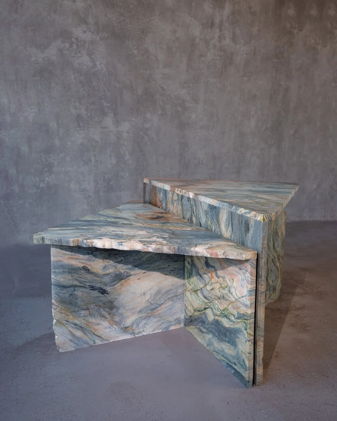 Our two-part Rift Table was crafted entirely from offcuts of Fusion quartzite, a striking Brazilian natural stone.
The size and shape of each piece guided the final form &mdash; a design that celebrates imperfection and chance.
Working with the freef