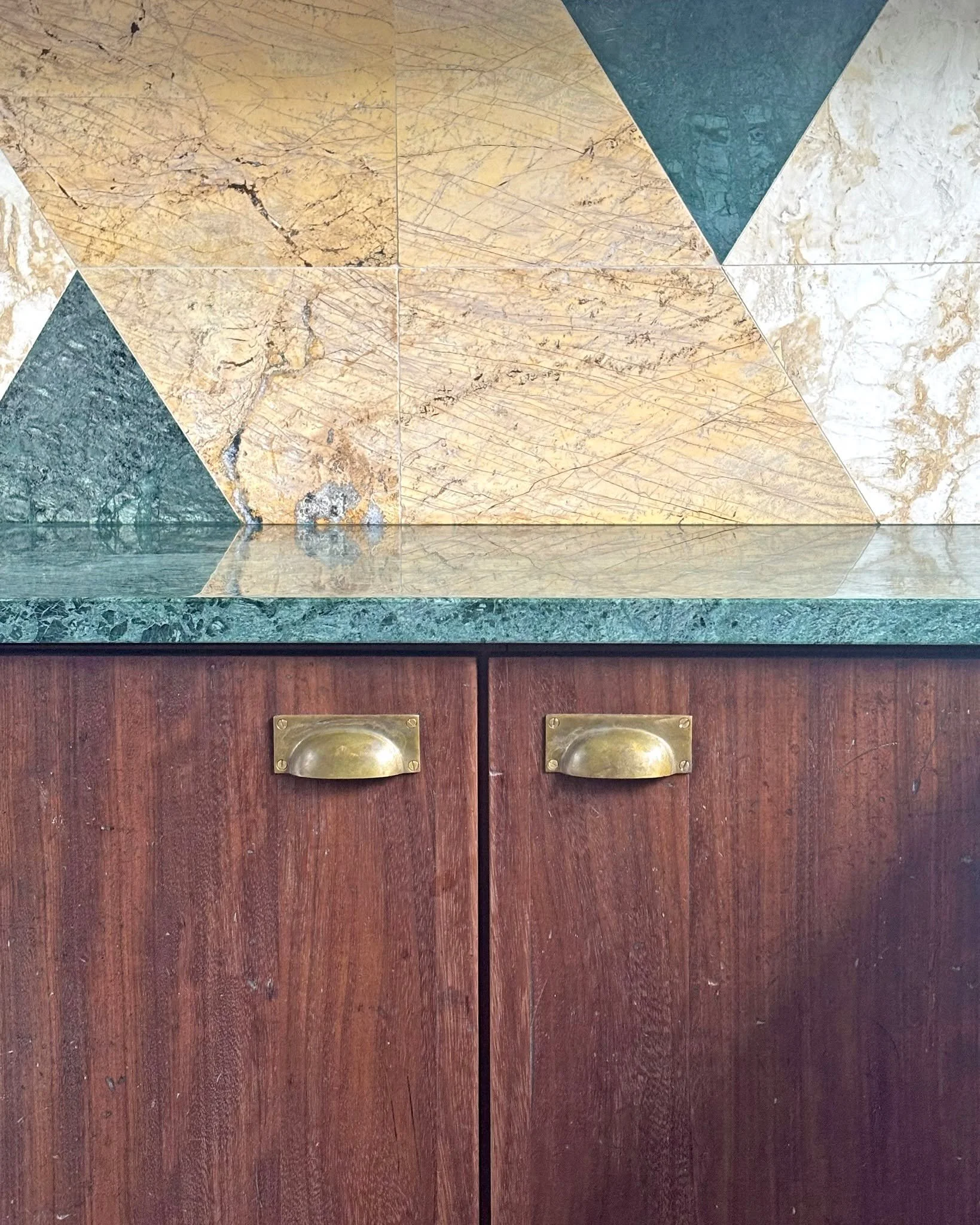 This kitchen renovation was Leleni Studios first opportunity to work with reclaimed materials of all types. Reusing offcuts of our marble and travertine, combined with reclaimed Iroko lab-tops and salvaged hardwood glazed doors was an absolute pleasu