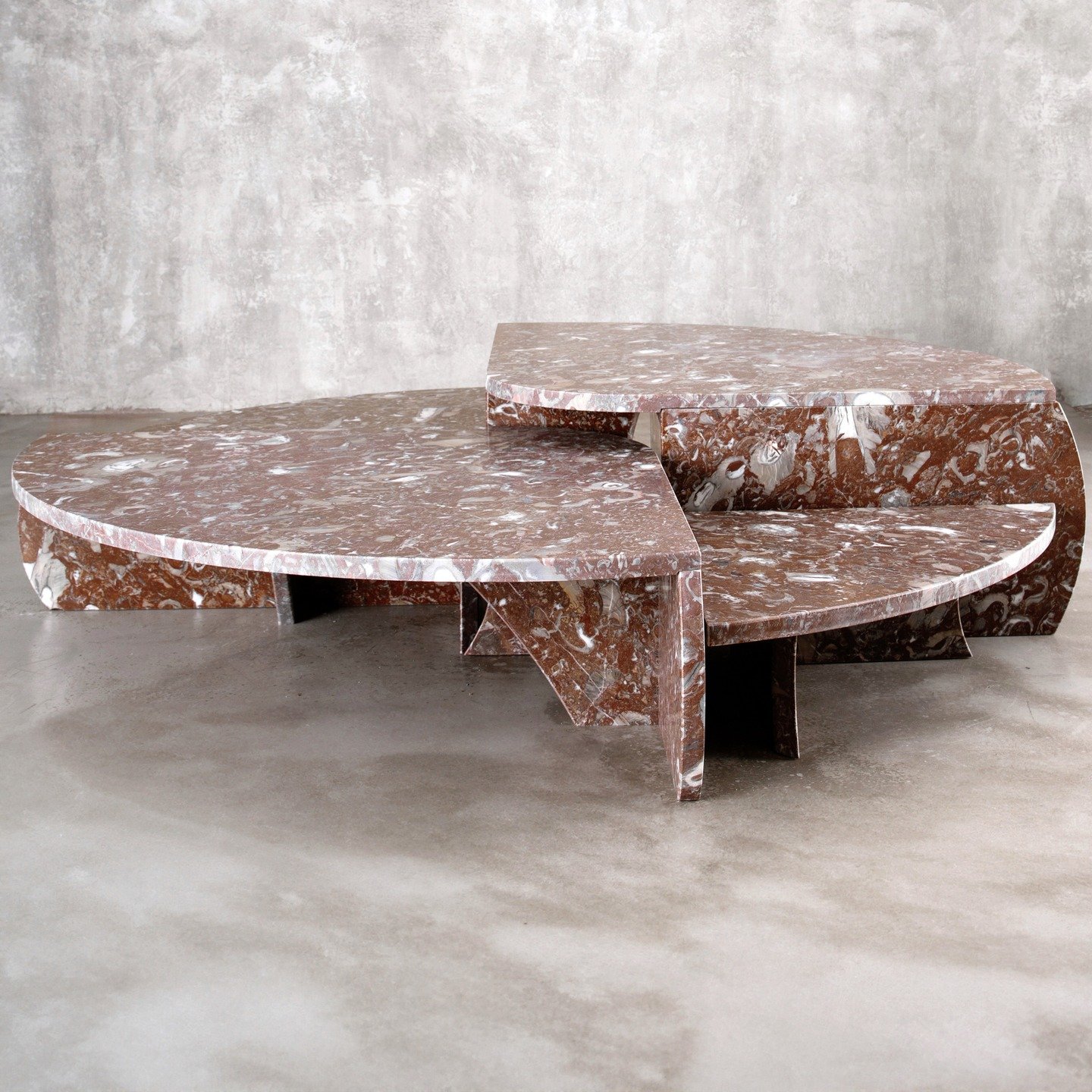 Made from forgotten slabs under the Spanish sun into a monumental 1.8-meter centerpiece, the 'Bilbao' coffee table is composed of four distinct, yet perfectly interlocking parts, each meticulously crafted from reclaimed red fossil marble offcuts. 

T