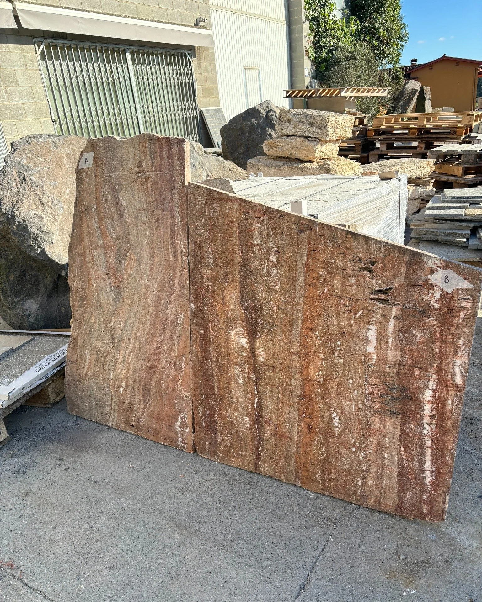 Composed of carefully selected reclaimed red travertine,  the triangular outdoor table combines offcuts to create a new whole.

The 1.3 meter top required dimensions we didn&rsquo;t have in a single piece. Instead, two 30mm offcuts were precisely cut