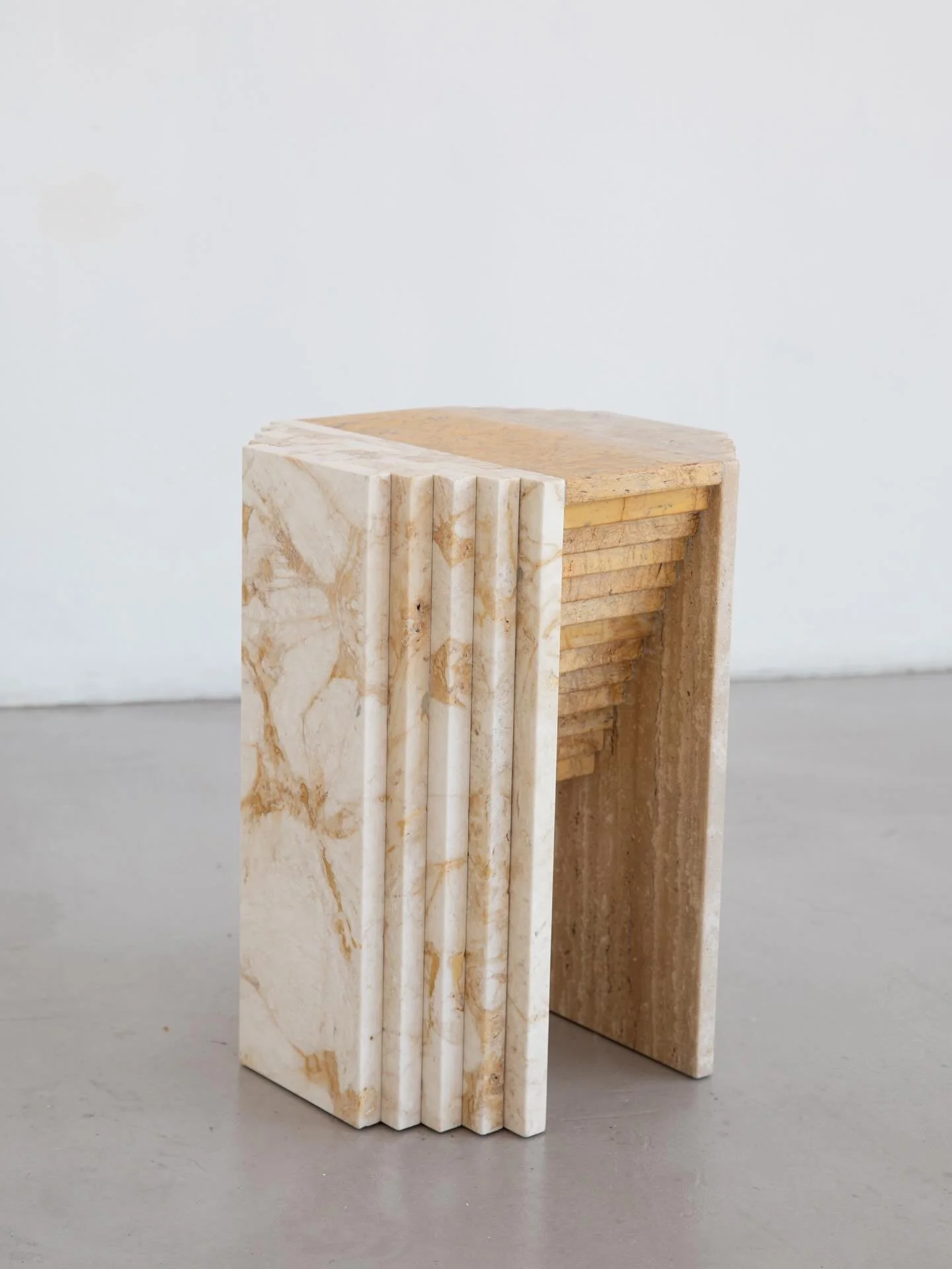 The Jester - acting the fool as a foot stool, side table, plinth or simply ornamental object.

Made entirely from abandoned floor tiles, this sturdy sculpture can be made in many materials embodying the ethos of transforming waste from the constructi