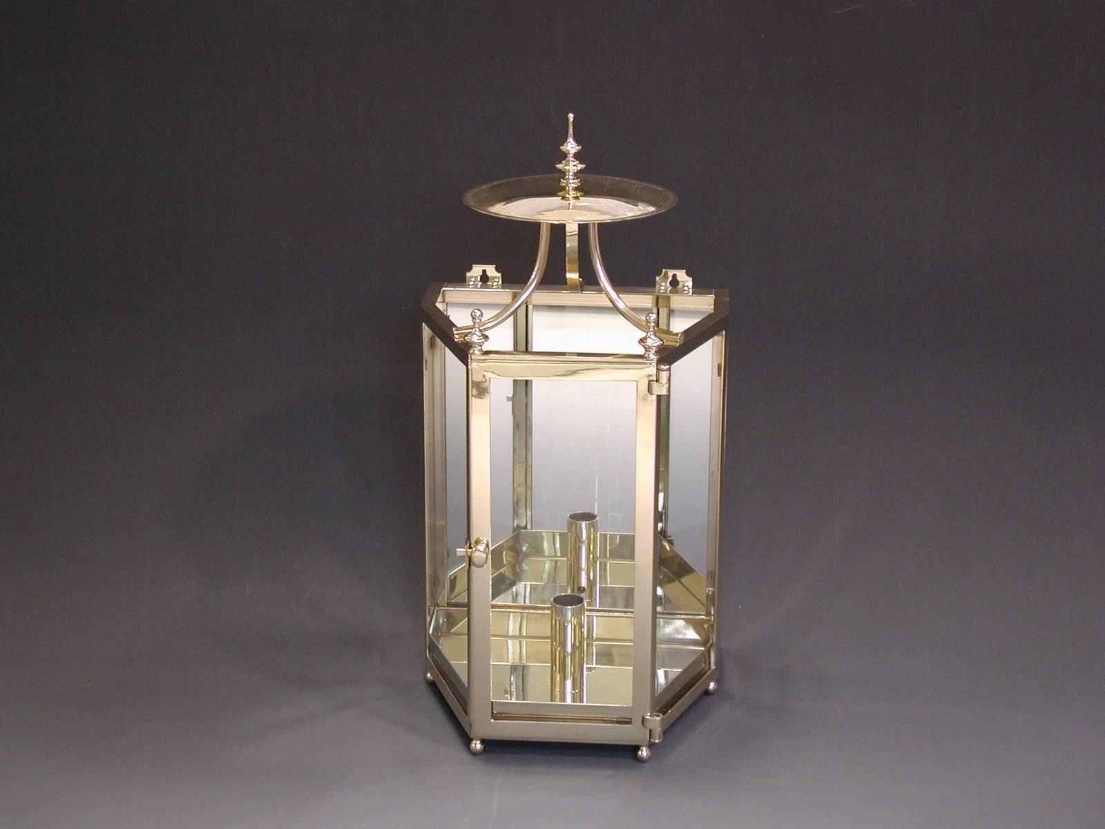 Polished metal and glass lantern