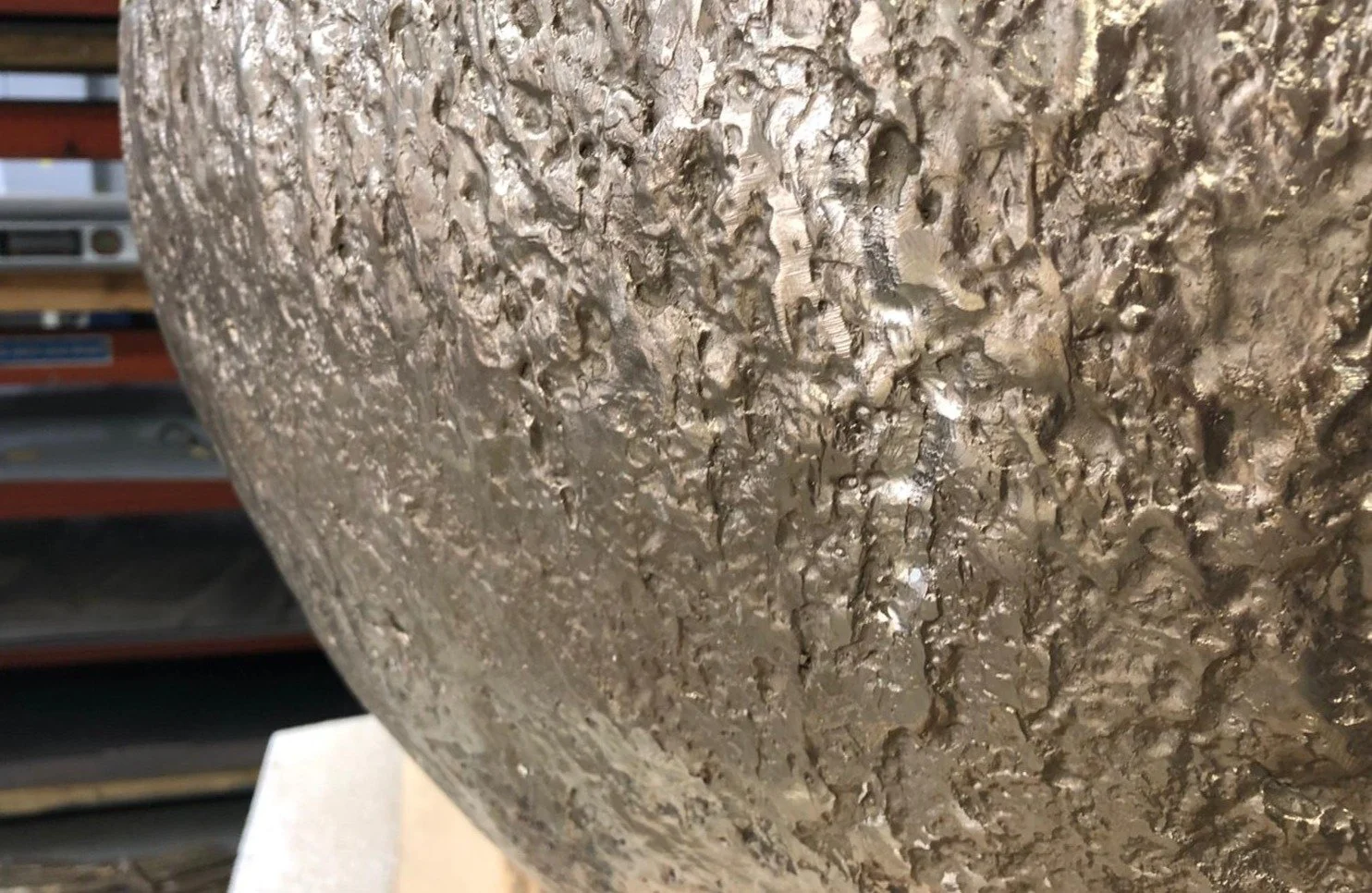 Part of a textured bronze coffee table