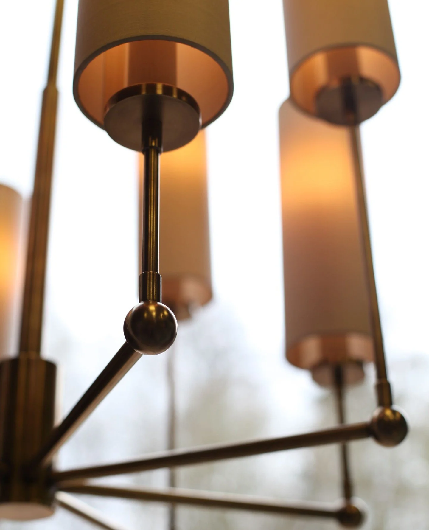 Elegant detail of a contemporary multi-arm chandelier.  Often the simplest forms are challenging.⁠