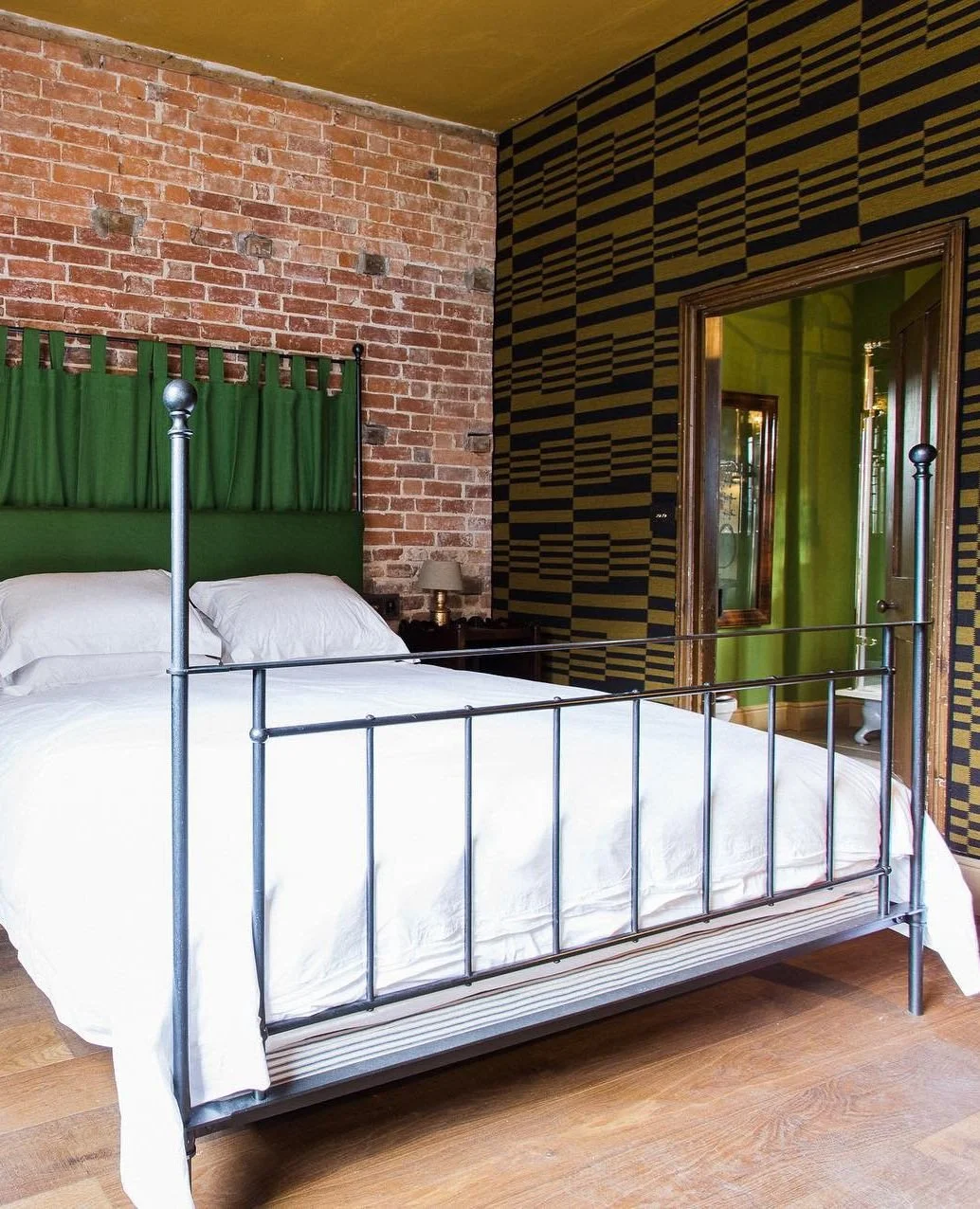 In the 19th Century Grooms Cottage @stgileshouse are two stunningly refurbished maisonettes, each with an equestrian theme.⁠
⁠
The two double bedrooms in each are complete with bespoke king size beds.  The iron bed seen here designed and made by us. 