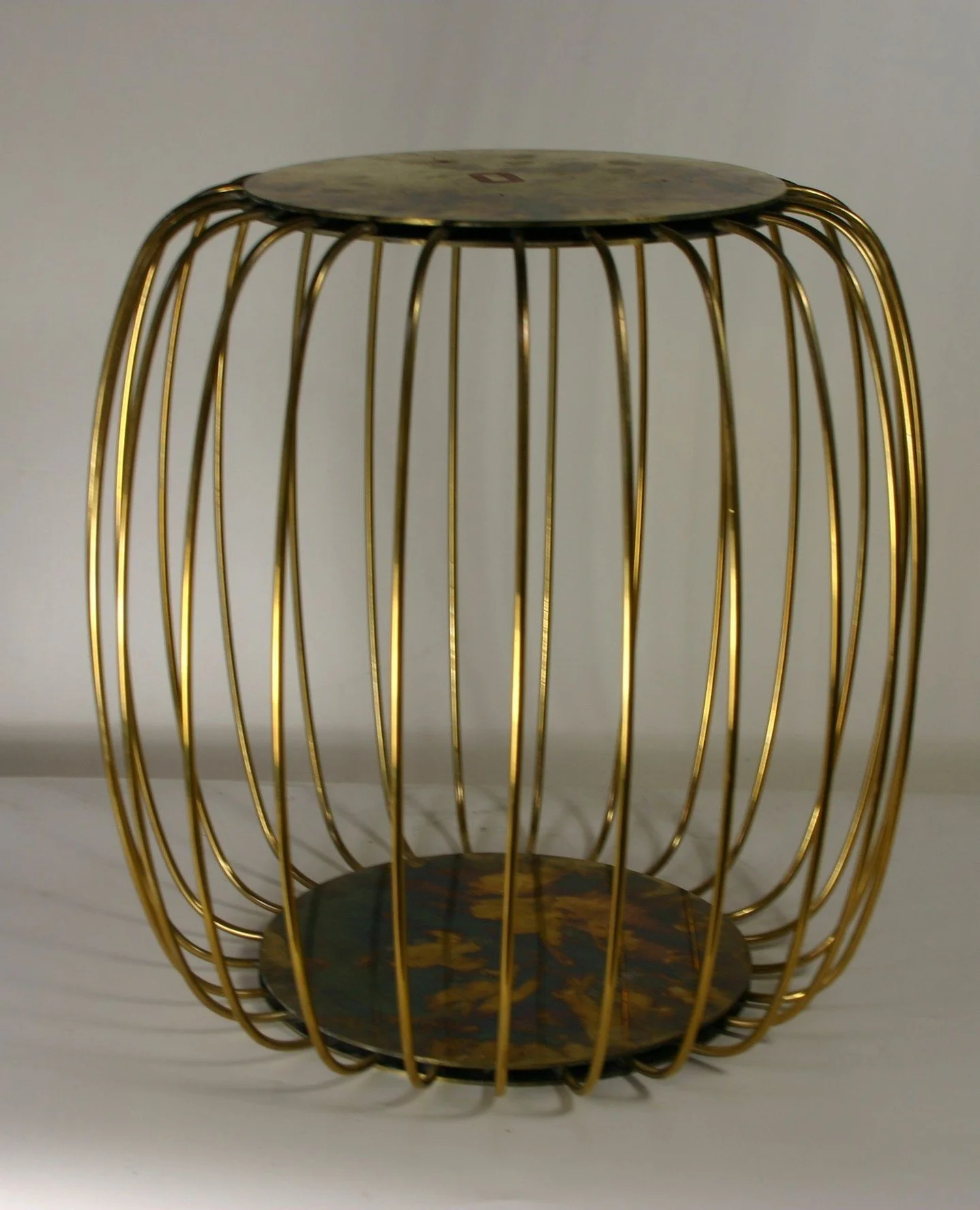 A brass side table made for Caroline Paterson Interior Design.  With its airy, cage-like form and rich golden finish, it brings lightness and structure into any space. Perfect for holding your morning coffee, a stack of books, or simply standing beau