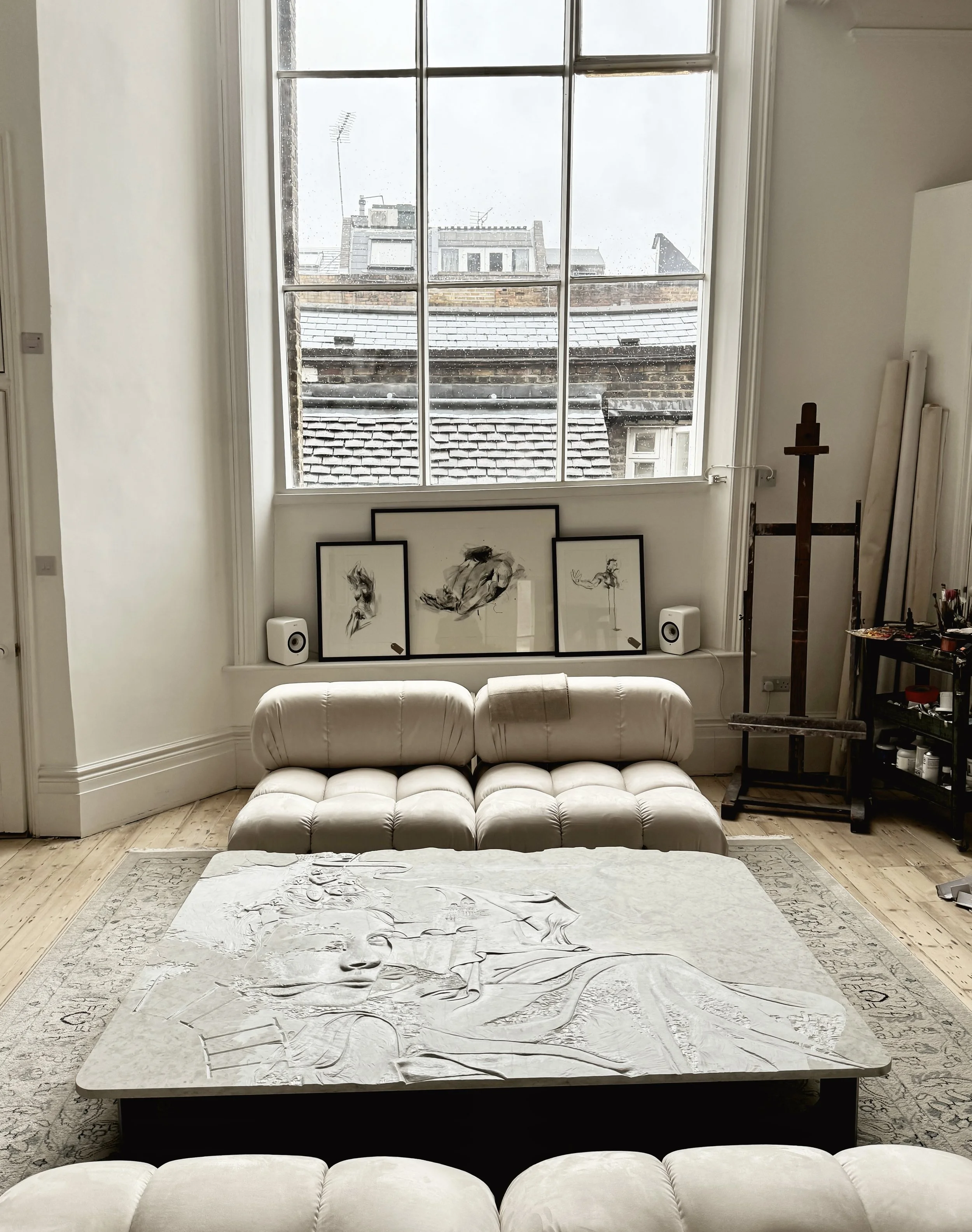Raine Storey relief sculpture used as a coffee table