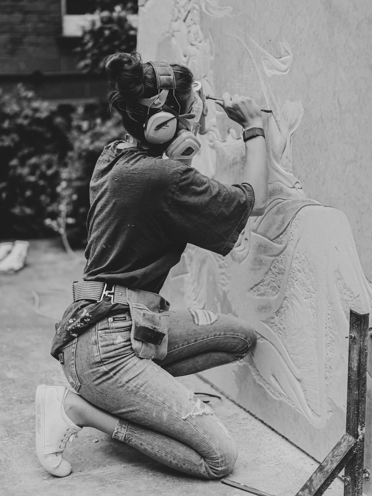Raine Storey creating a stone relief for The Sloane Club, Chelsea