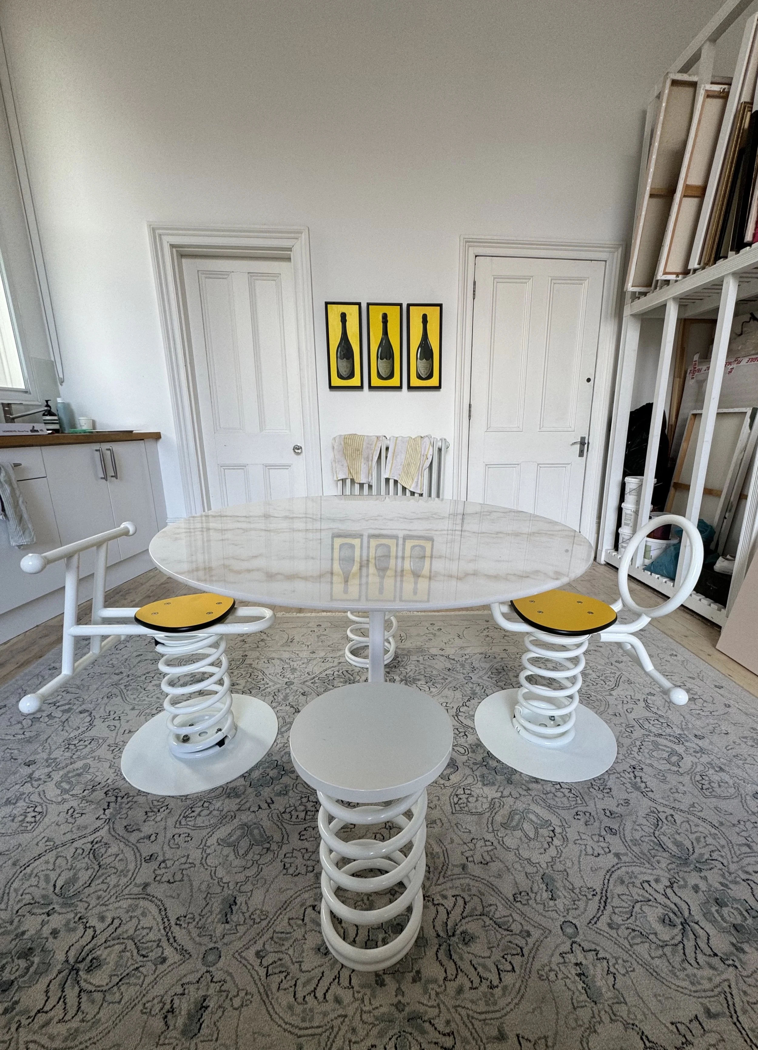 Contemporary metal dining table and chairs by Raine Storey