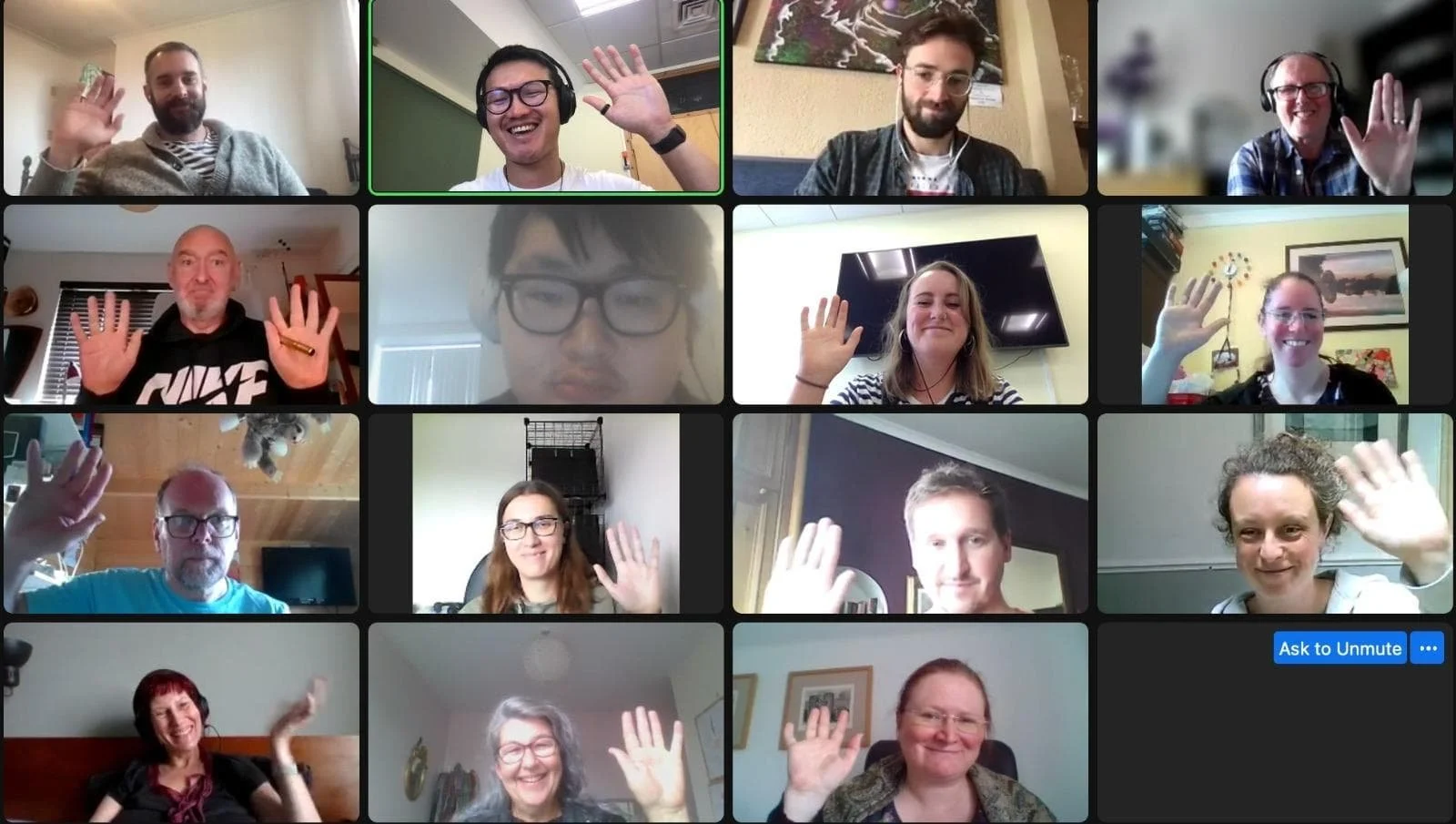 a screenshot of participants at our online meeting, with people waving and smiling