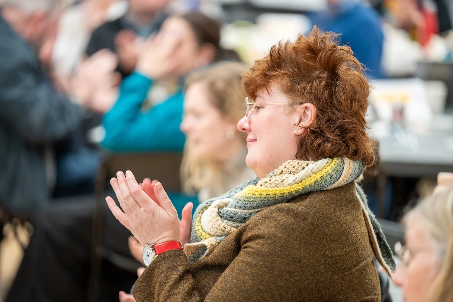 Community Knowledge Matters Gathering - November 2025 - person clapping and smiling - Image Credit Alexander Williamson www.alexander-williamson.com115.jpg